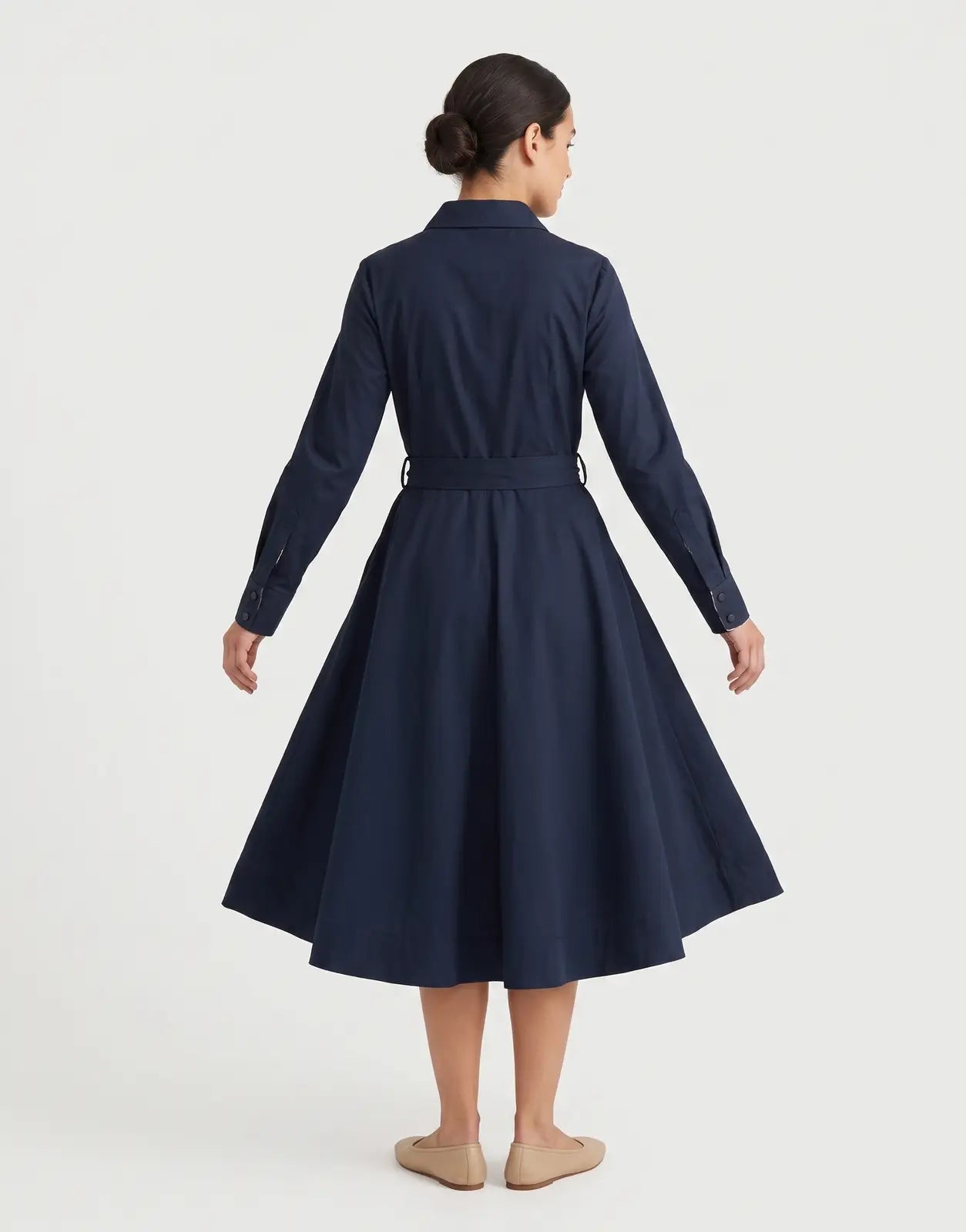 Ben Sherman Diana Fit & Flare Navy Dress. A women's long-sleeved, belted midi dress in a dark blue, smooth fabric, viewed