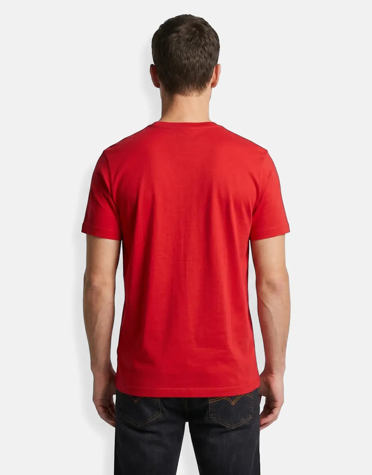 Rear view of a man wearing a red Ben Sherman Music Innovation t-shirt and dark jeans.
