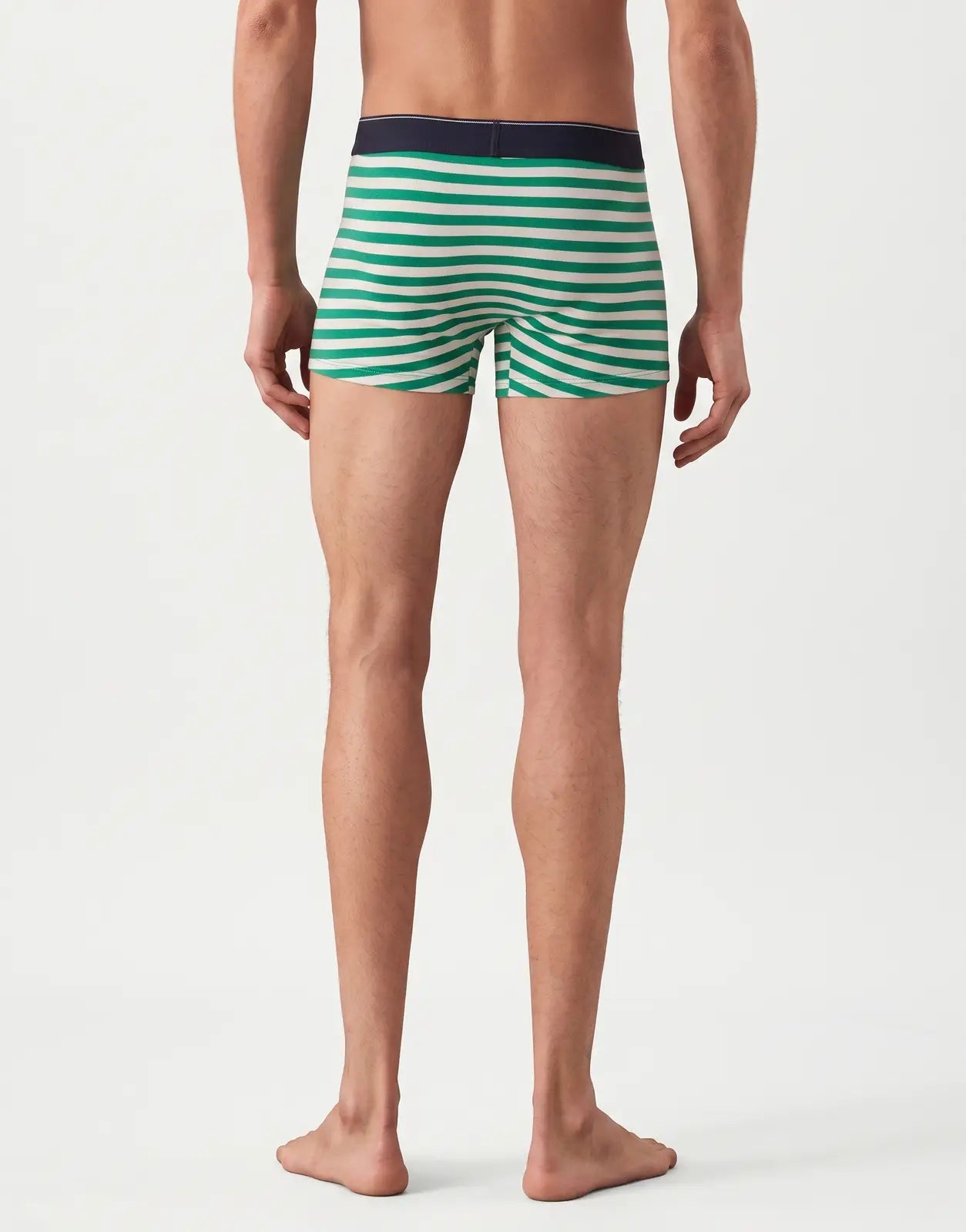 Back view of Calvin Klein 3 Pack Blue Multi Trunks on a man. The trunks feature distinct green and white horizontal stripes