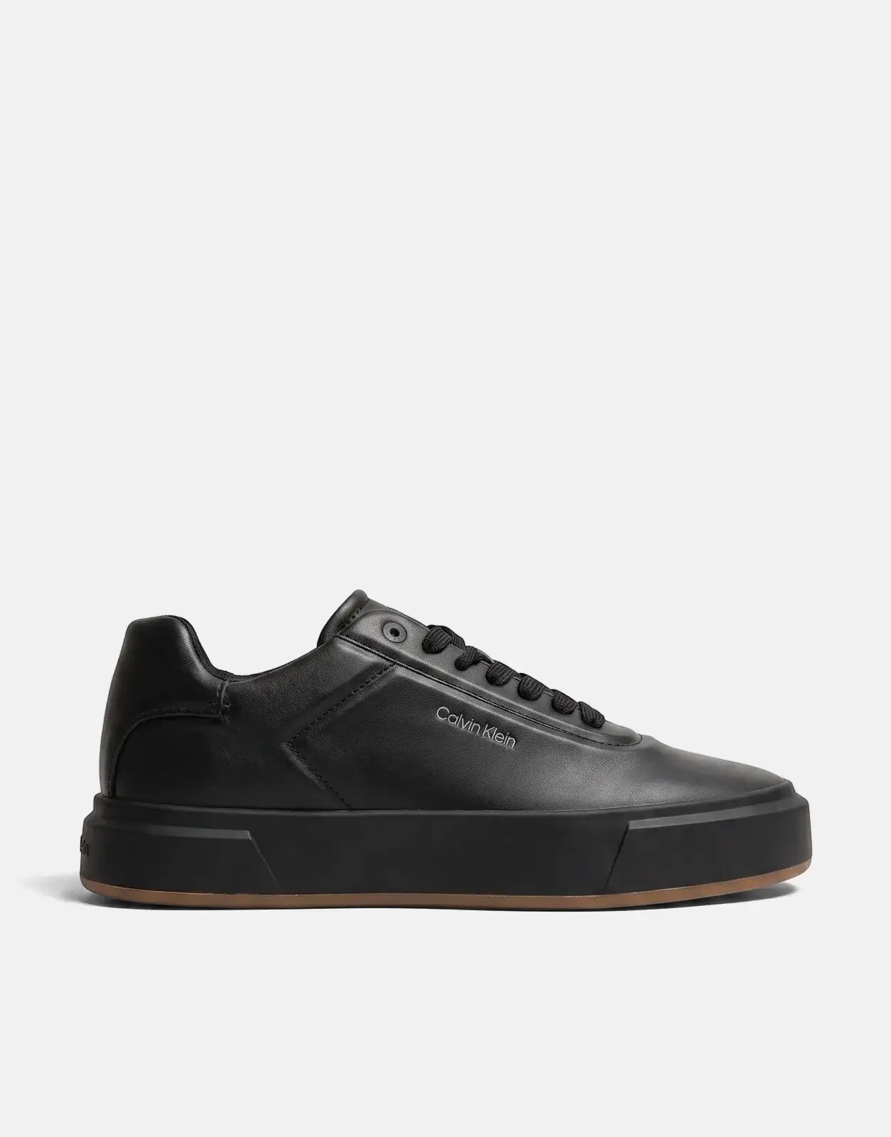 Black Calvin Klein Basket Cupsole Oxford lace-up sneakers crafted from leather with a thick sole and brown outsole, viewed