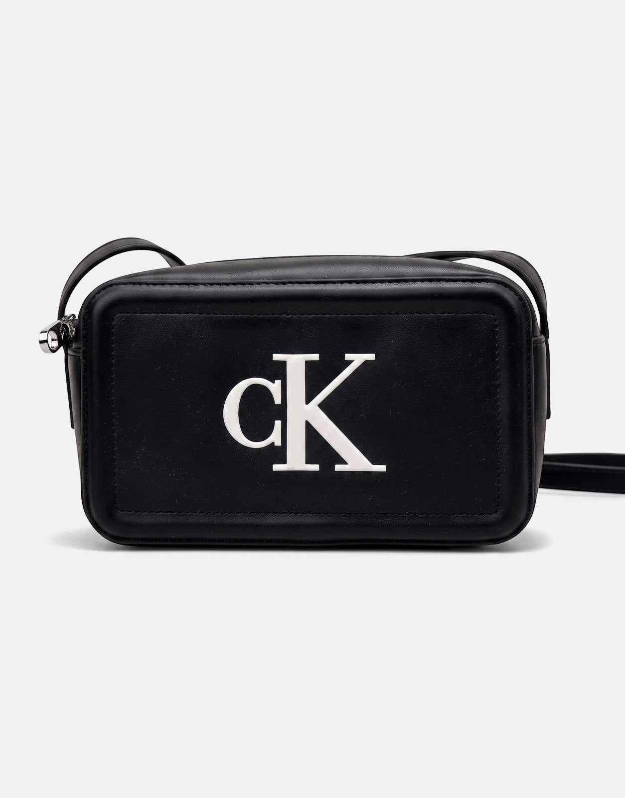 Black Calvin Klein Bold CK camera bag with a white logo on the front, featuring a zippered closure and an adjustable strap,