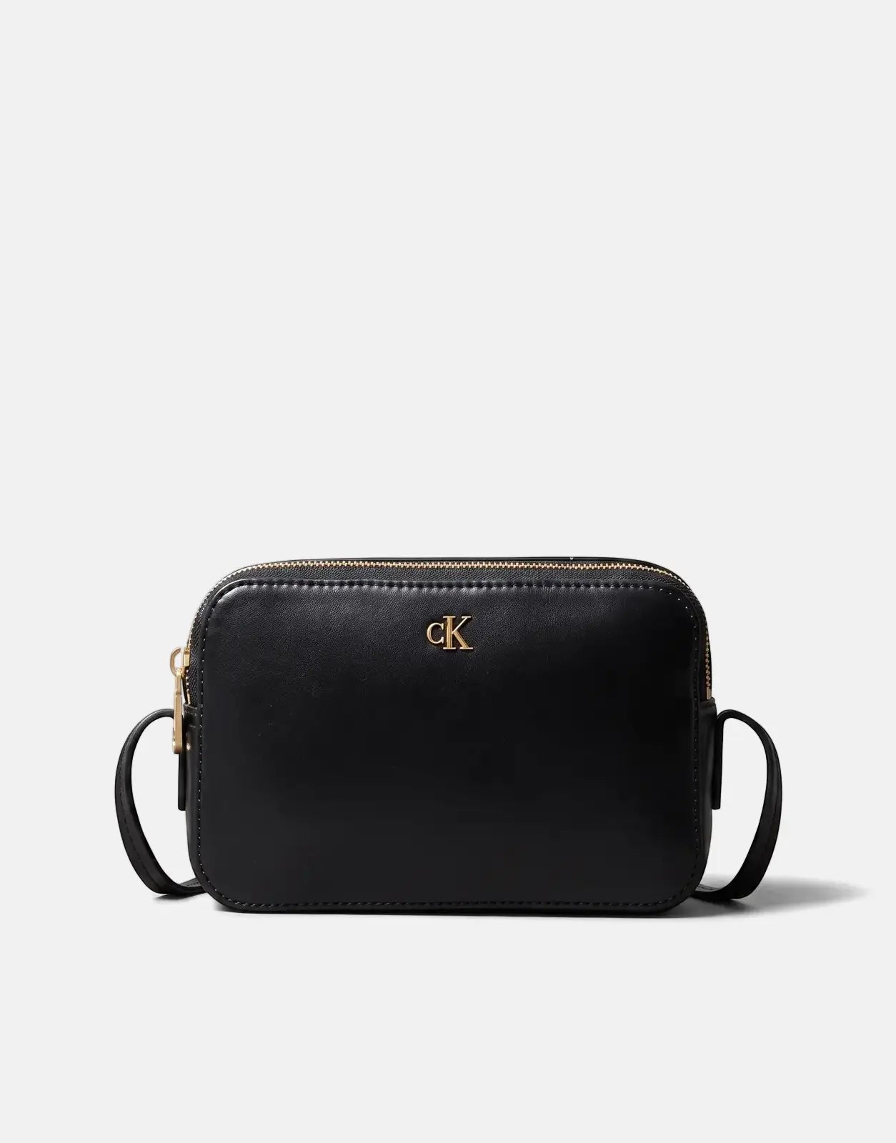 Black Calvin Klein camera bag with a smooth leather finish and gold 'cK' logo on the front, shown from a front view.