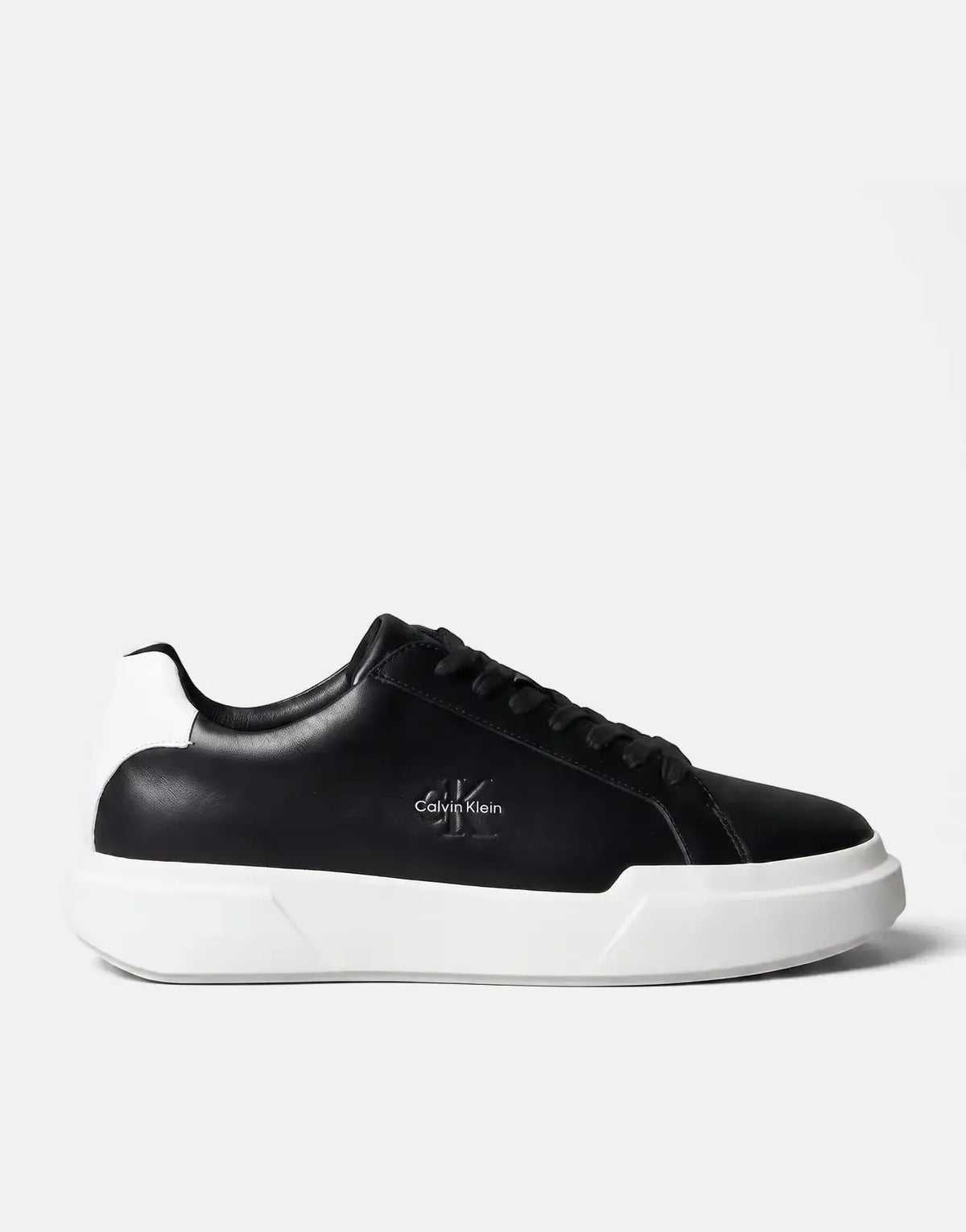 Calvin Klein Chunky Cupsole Sneaker in black and white, featuring a low-top design, shown from a side view.