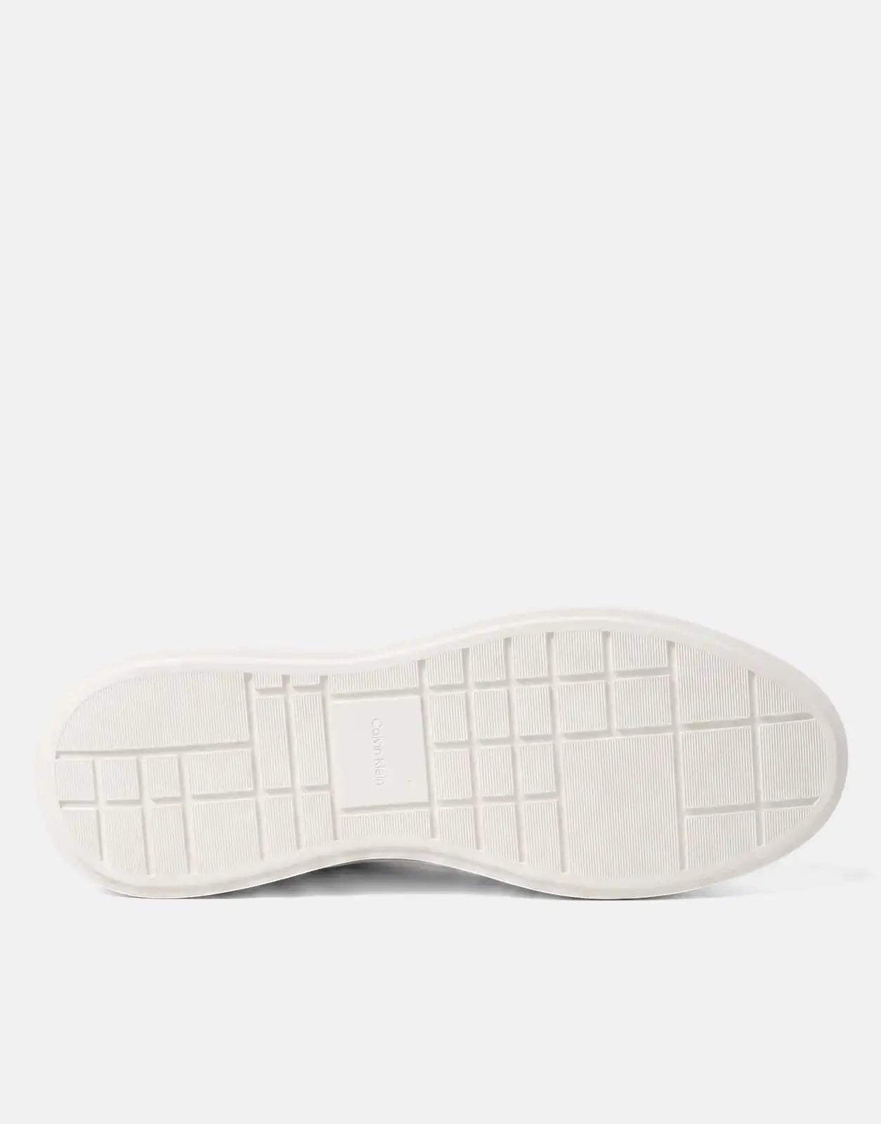 Bottom view of a Calvin Klein Chunky Cupsole White Sneaker, showcasing the structured sole and tread pattern.