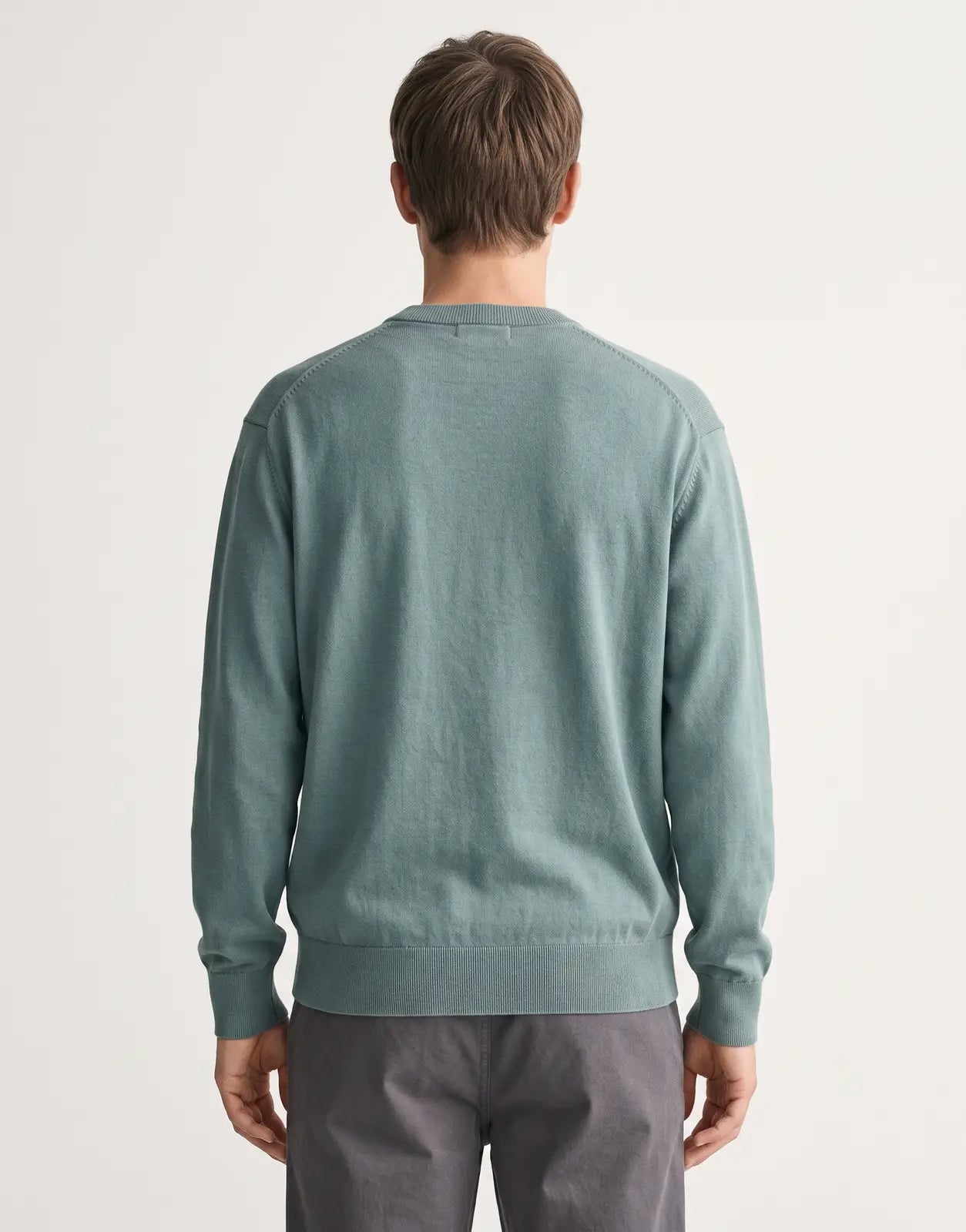 Back view of a Calvin Klein EU Cotton Relaxed Green Sweatshirt, showcasing its soft cotton fabric and relaxed fit.