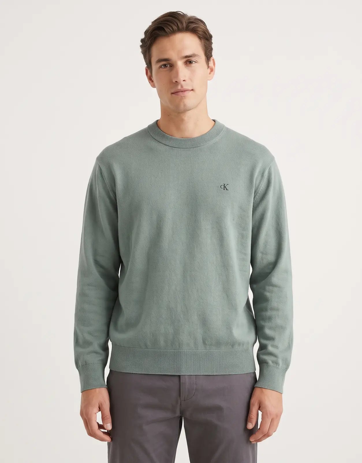 Calvin Klein EU Cotton Relaxed Green Sweatshirt, a sage green long-sleeved crew neck top with a relaxed fit.