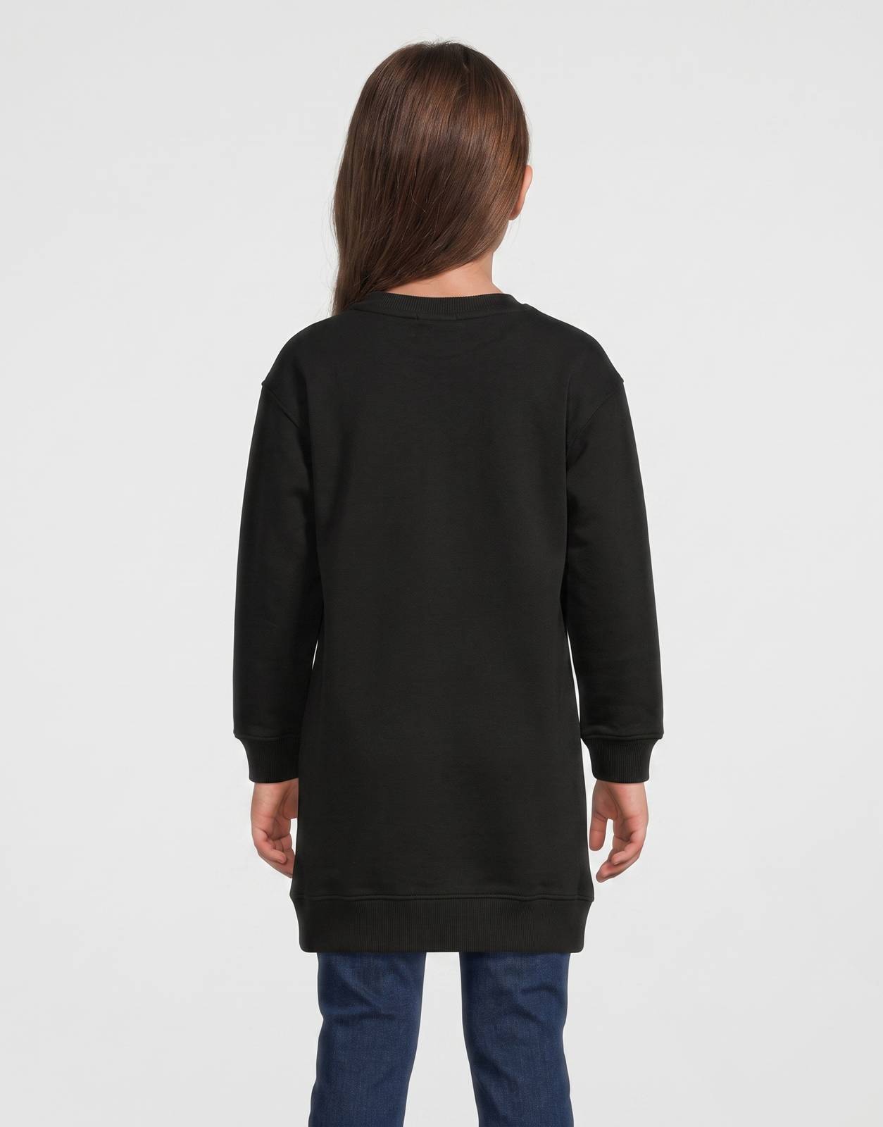 Back view of a child modeling a black long-sleeve Calvin Klein Kids Terry ML Dress, showcasing its smooth fabric.
