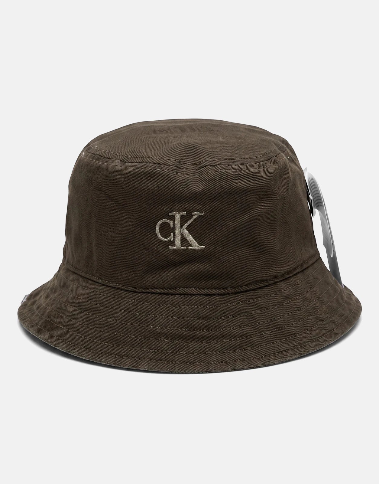 Dark brown Calvin Klein reversible bucket hat made from washed material, featuring an embroidered CK logo on the front.