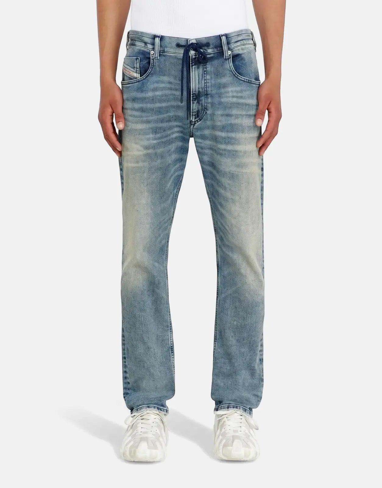 Light blue Diesel 2032 D-Krooley B Jogger jeans for men, featuring distressed denim and a drawstring waist, worn by a model.