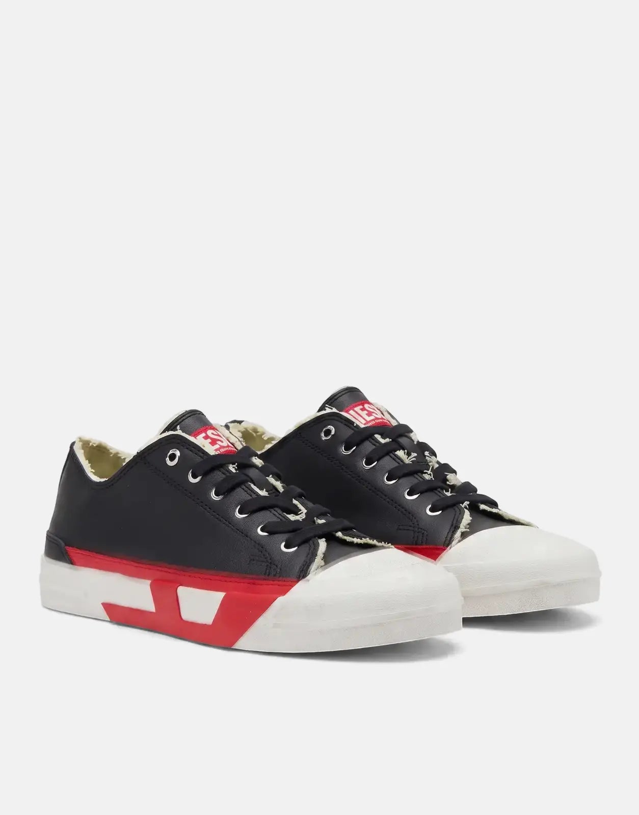 Diesel D-Verse Low II sneakers in black and red, featuring white rubber toe caps and distressed details, presented in a