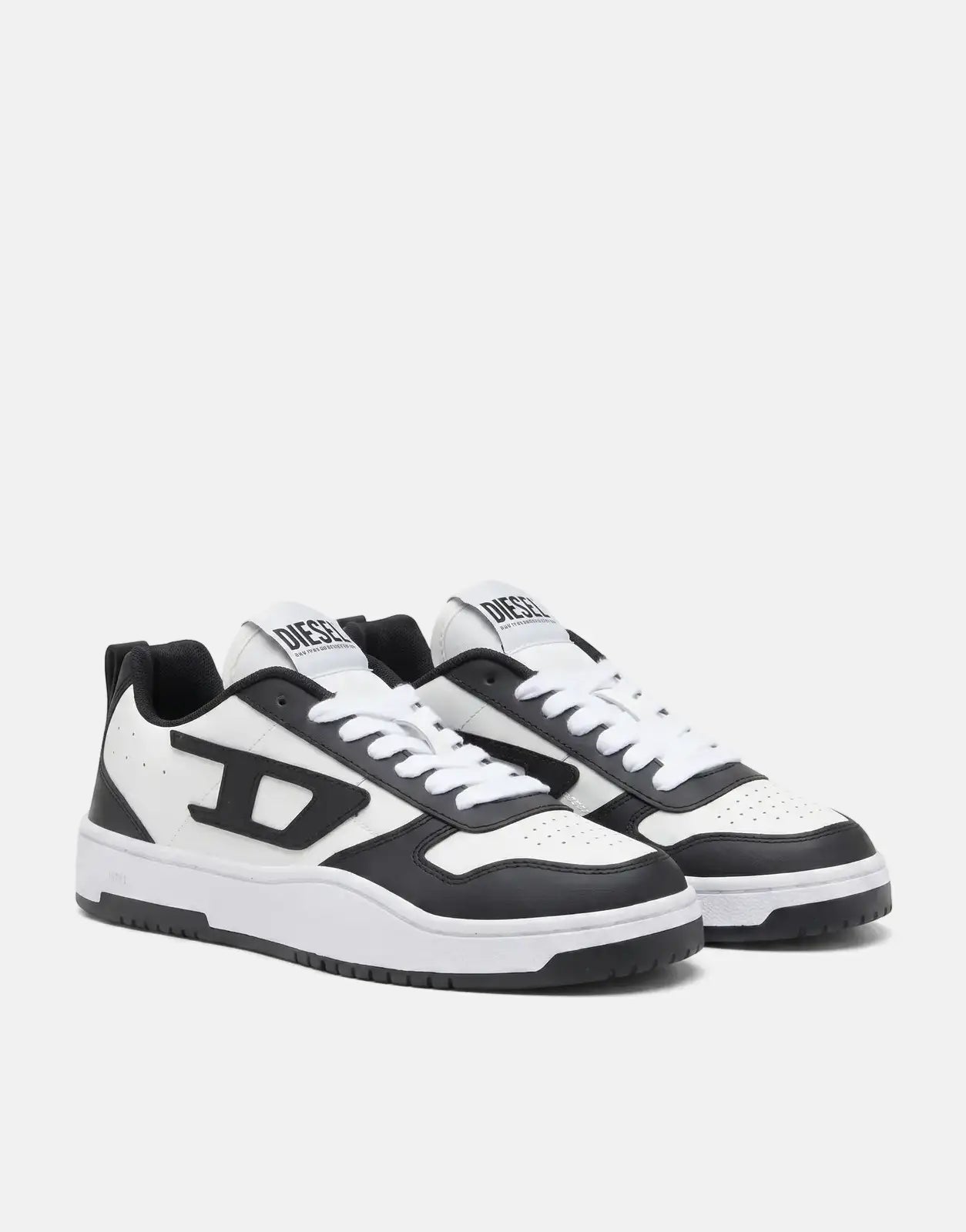 Pair of Diesel S-Ukiyo V2 Low Sneakers in white and black leather, featuring a prominent D-logo and white laces, presented