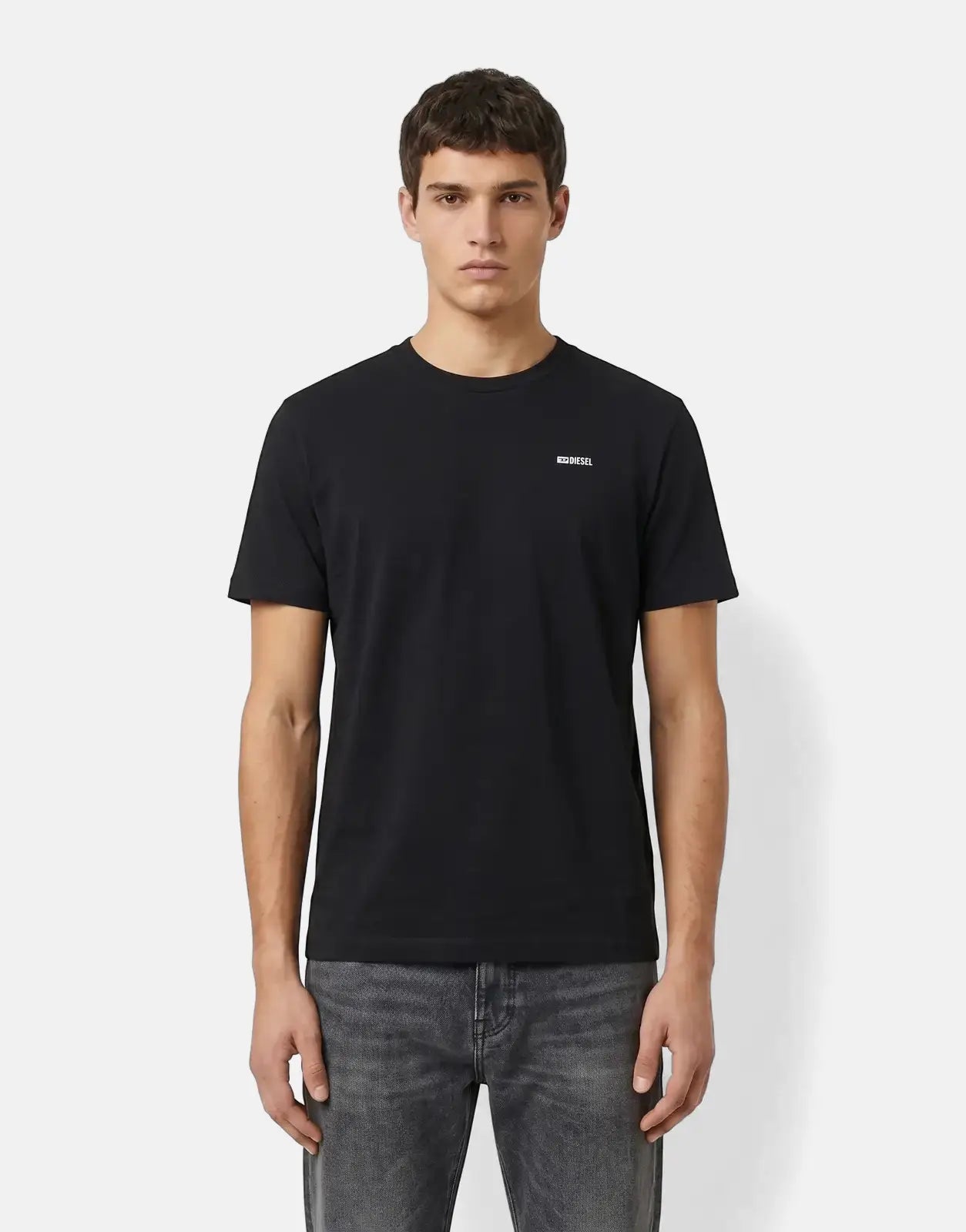 Black Diesel T-Adjust Met T-Shirt for men, styled with grey jeans, worn by a model in a front view.
