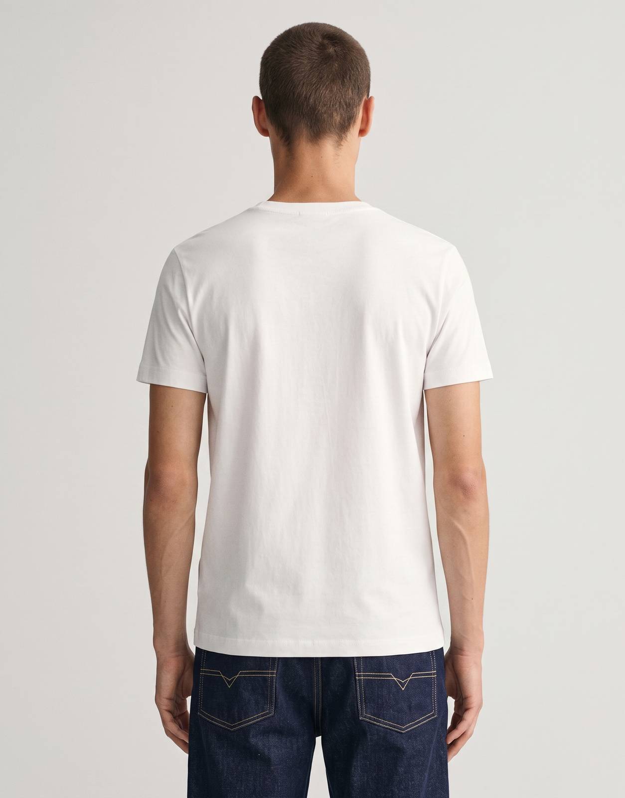 A white Diesel T-Miegor K77 short-sleeve t-shirt on a male model, captured from the back.
