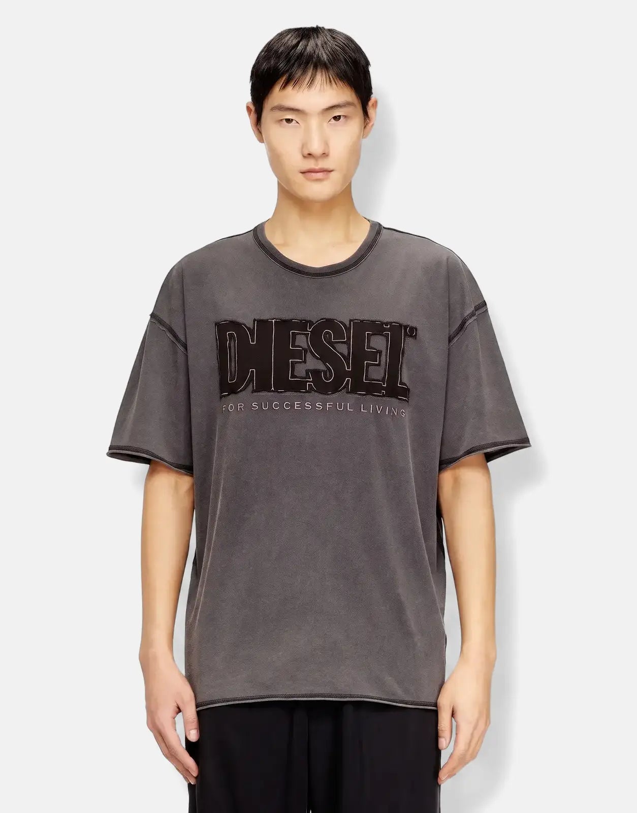 Men's charcoal grey Diesel T-Rawboxt relaxed fit short sleeve t-shirt with black logo patch on front, worn by a model.
