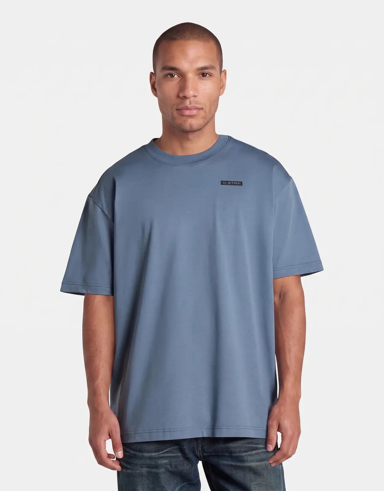 G-Star RAW 89 Back Graphic Relaxed Grit T-Shirt in blue on a male model, front view, short sleeve.