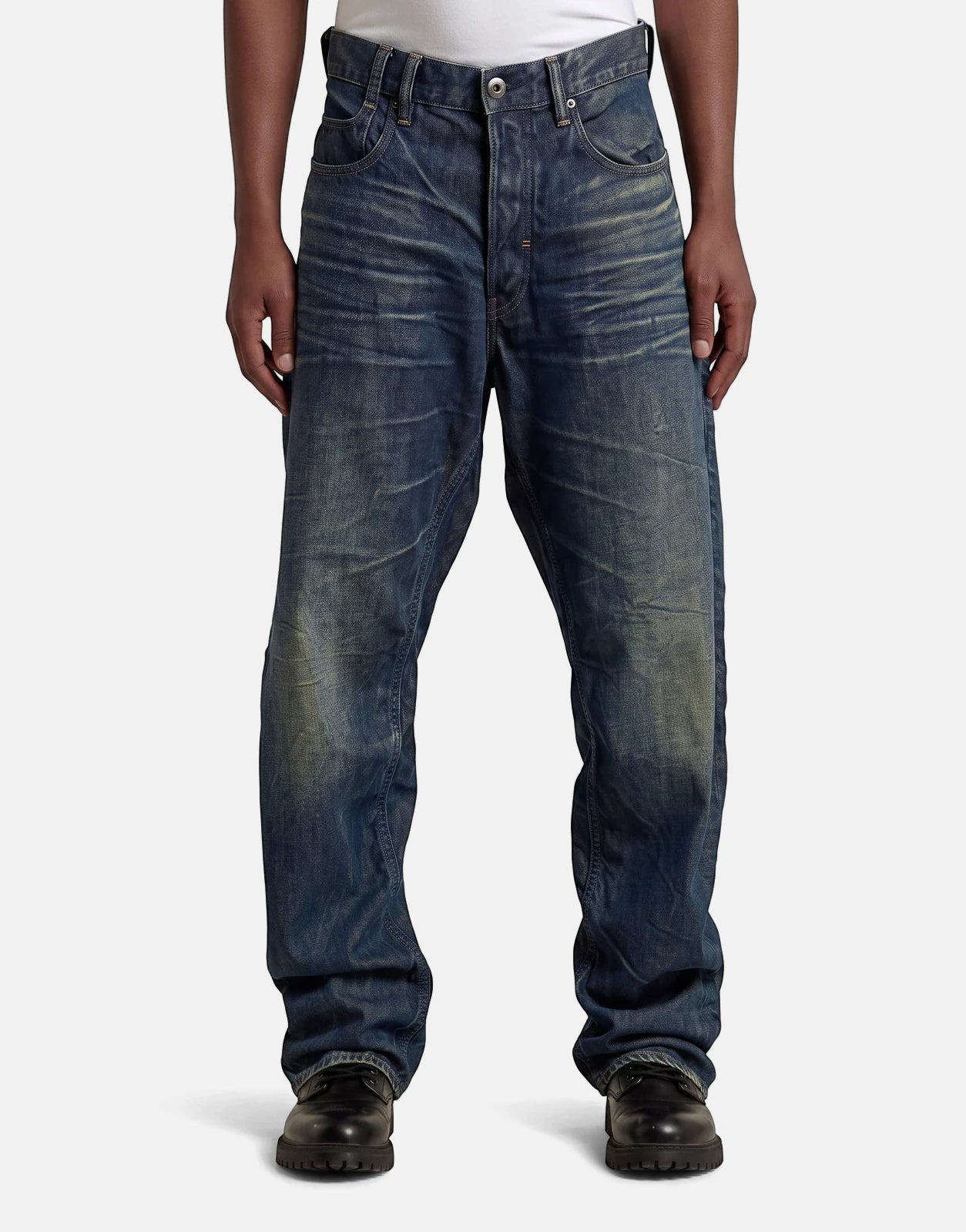 G-Star RAW Arc 3D Loose Raw Vintage Jeans in dark blue denim, featuring a relaxed fit and worn finish, worn by a model.