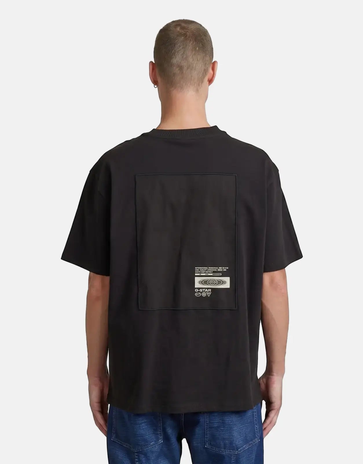 G-Star RAW Back Applique Relaxed Black T-Shirt worn by a male model from the back, showcasing the graphic print.