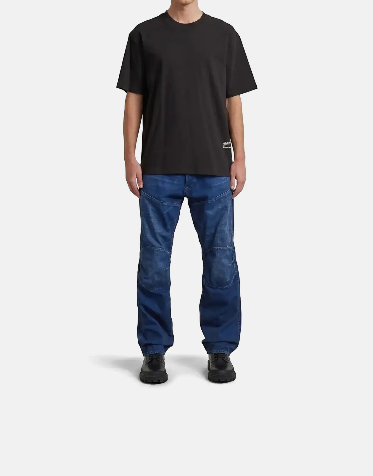 G-Star RAW Back Applique Relaxed Black T-Shirt on male model, styled with blue jeans, full body shot.