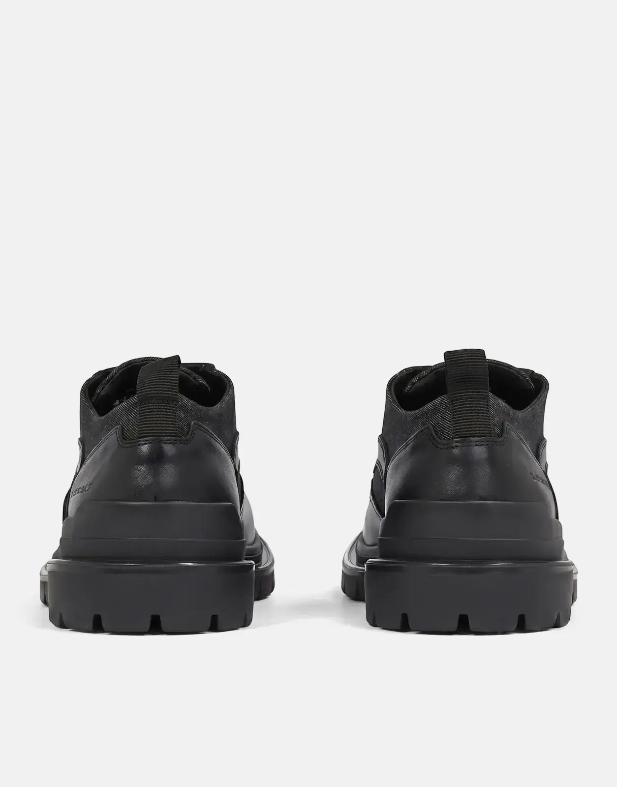 Rear view of G-Star RAW Blake BRQ Denim Shoes. These black mid-top boots feature a durable denim upper and rugged lug soles.
