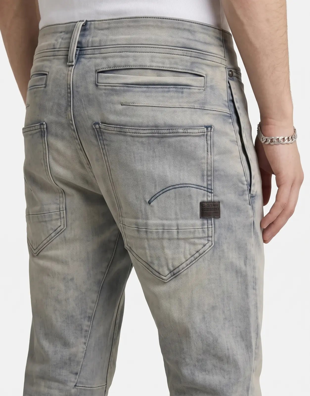 G-Star RAW D-Staq 3D Slim Antic Faded Radium jeans in light grey denim, back view showing pocket and logo patch.