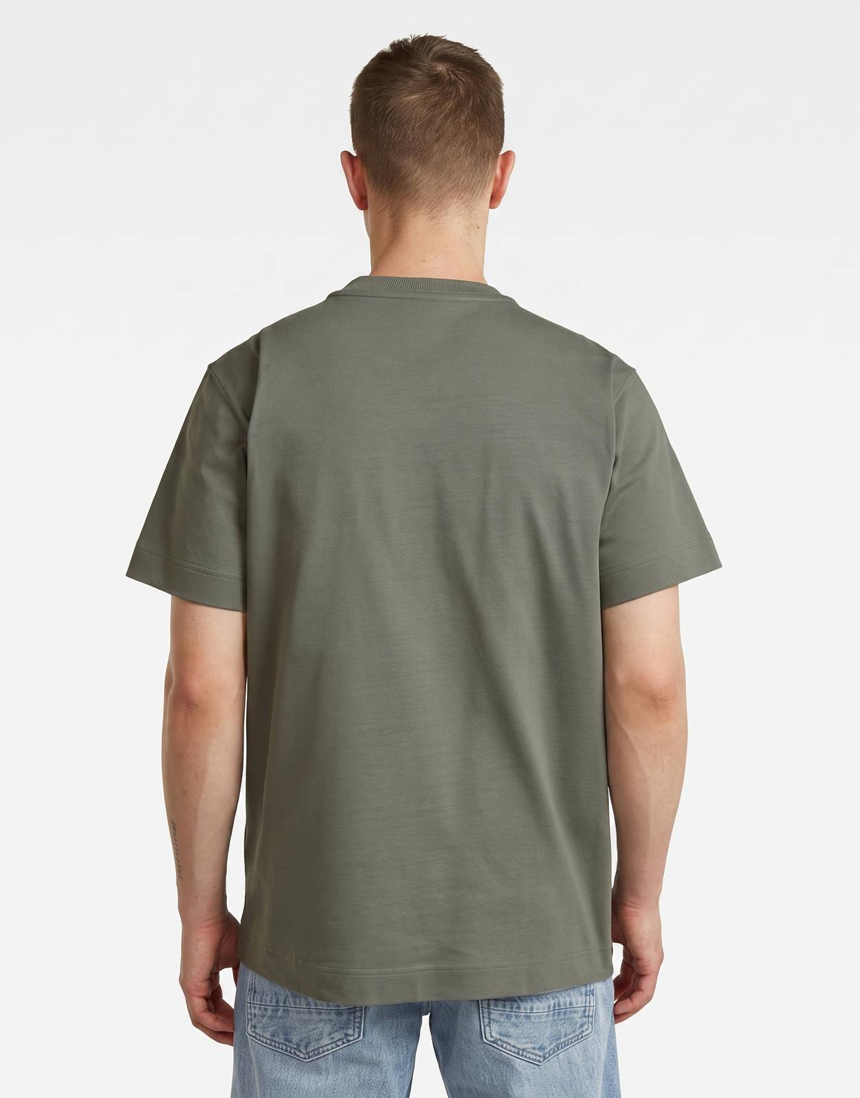 A man from behind wearing a G-Star RAW GS-01 Orphus T-Shirt in olive green. The t-shirt has a round neck and short sleeves.