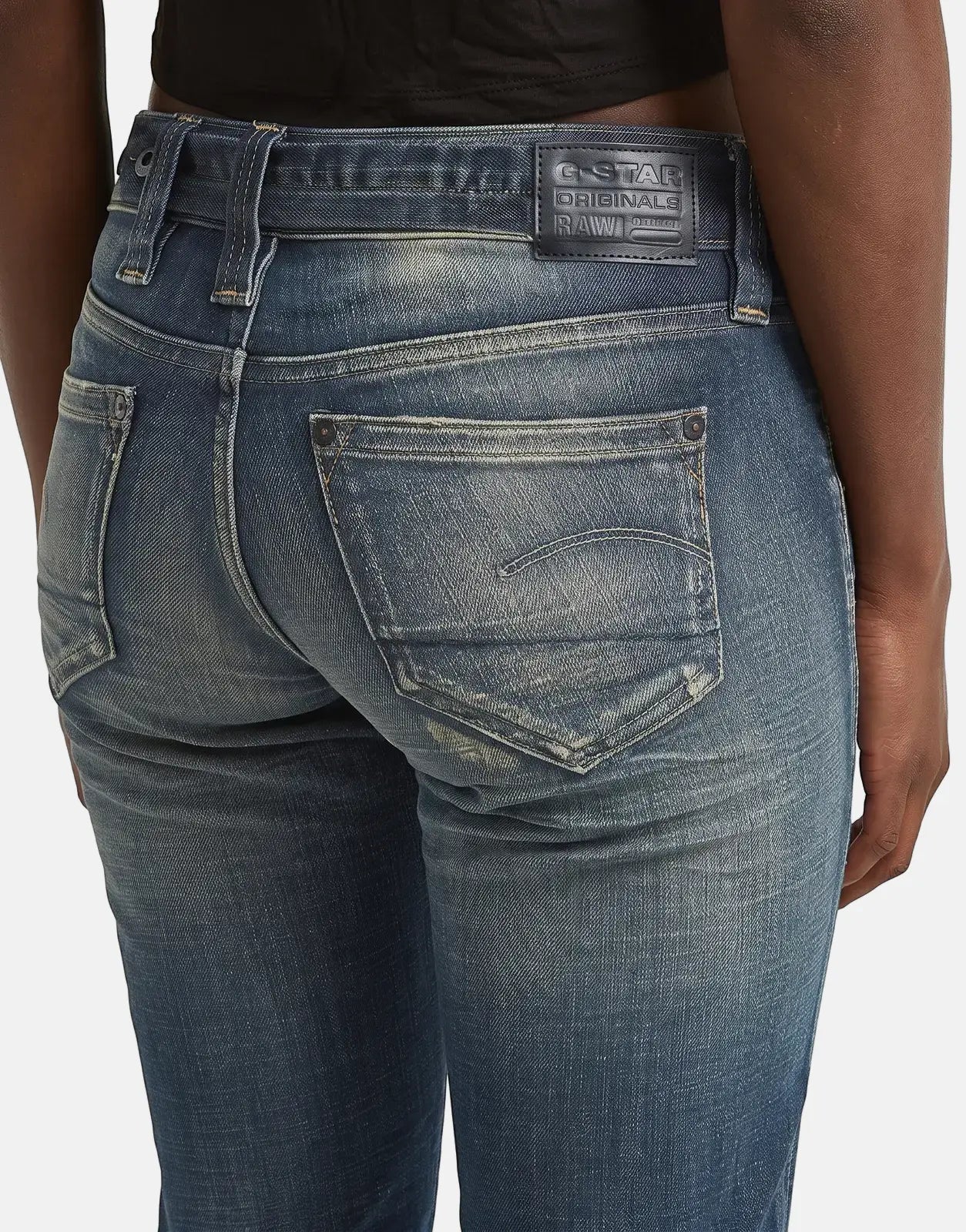 Back view of G-Star RAW Radar Slim Straight Vintage Desert Blue Jeans on a person, showcasing the distressed denim wash and