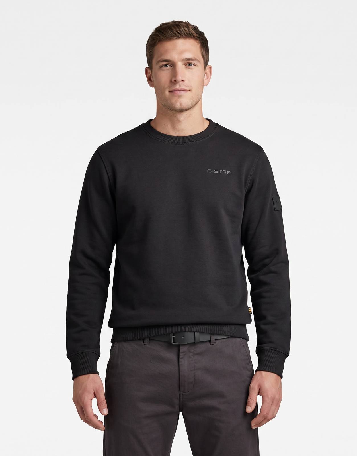 A G-Star RAW Regular Fit black sweatshirt, featuring long sleeves and the brand's logo on the chest, displayed flat on a