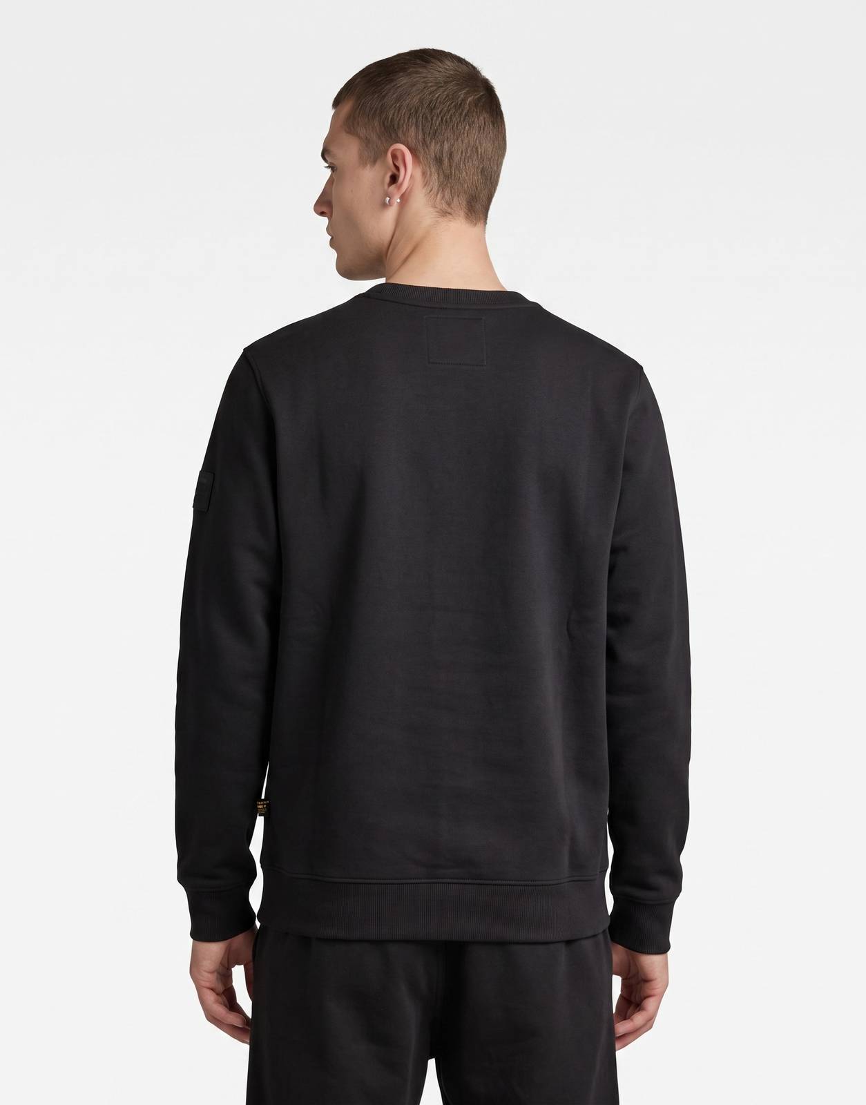 A G-Star RAW Regular Fit Black Sweatshirt, presented from the back, featuring its smooth black fabric and classic crewneck