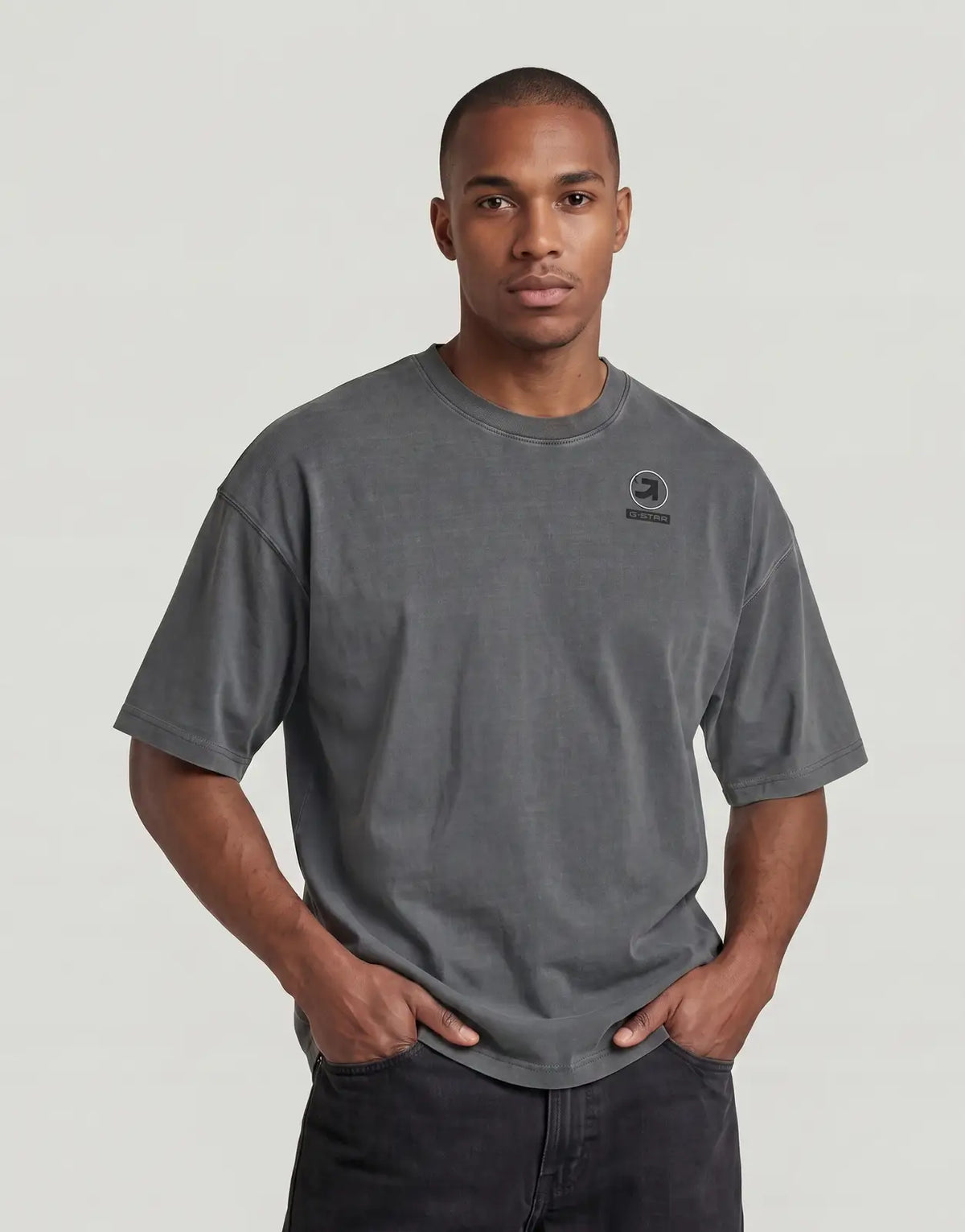 Front view of a G-Star RAW Washed Multi GR Oversized T-Shirt on a male model, featuring a relaxed fit and a distinctive