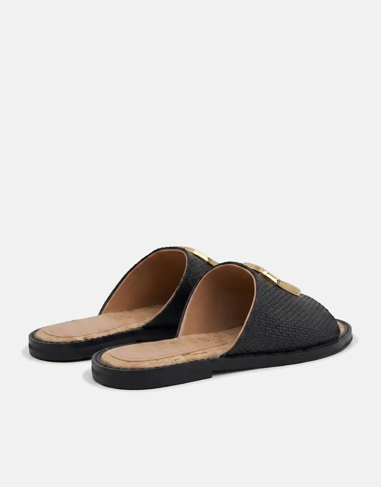 Guess Graysie AFW black woven slide sandals with a gold buckle and cork footbed, shown on a white background.