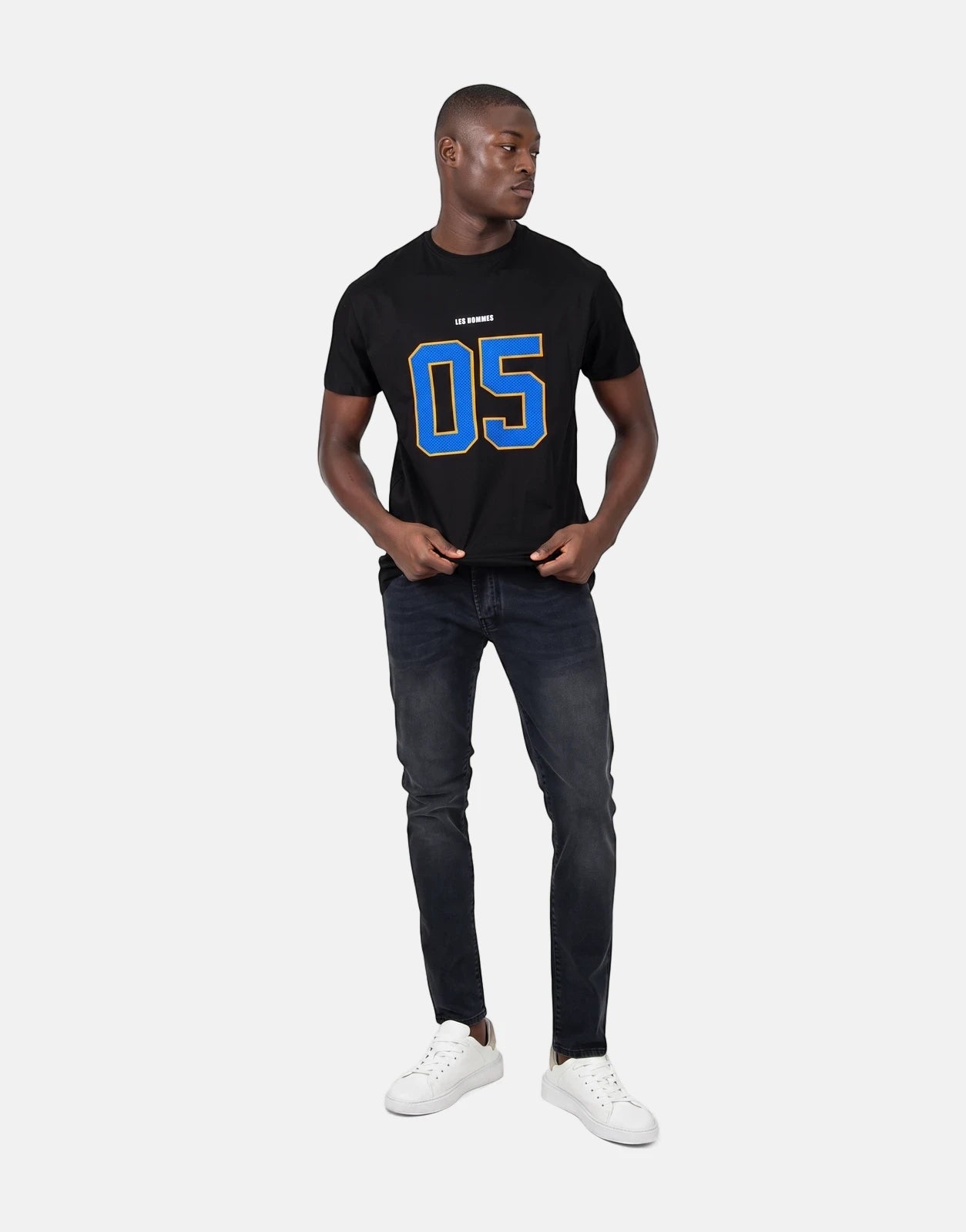 Les Hommes 05 Black T-shirt for men, featuring a blue '05' graphic and 'LES HOMMES' text, worn by a male model with dark