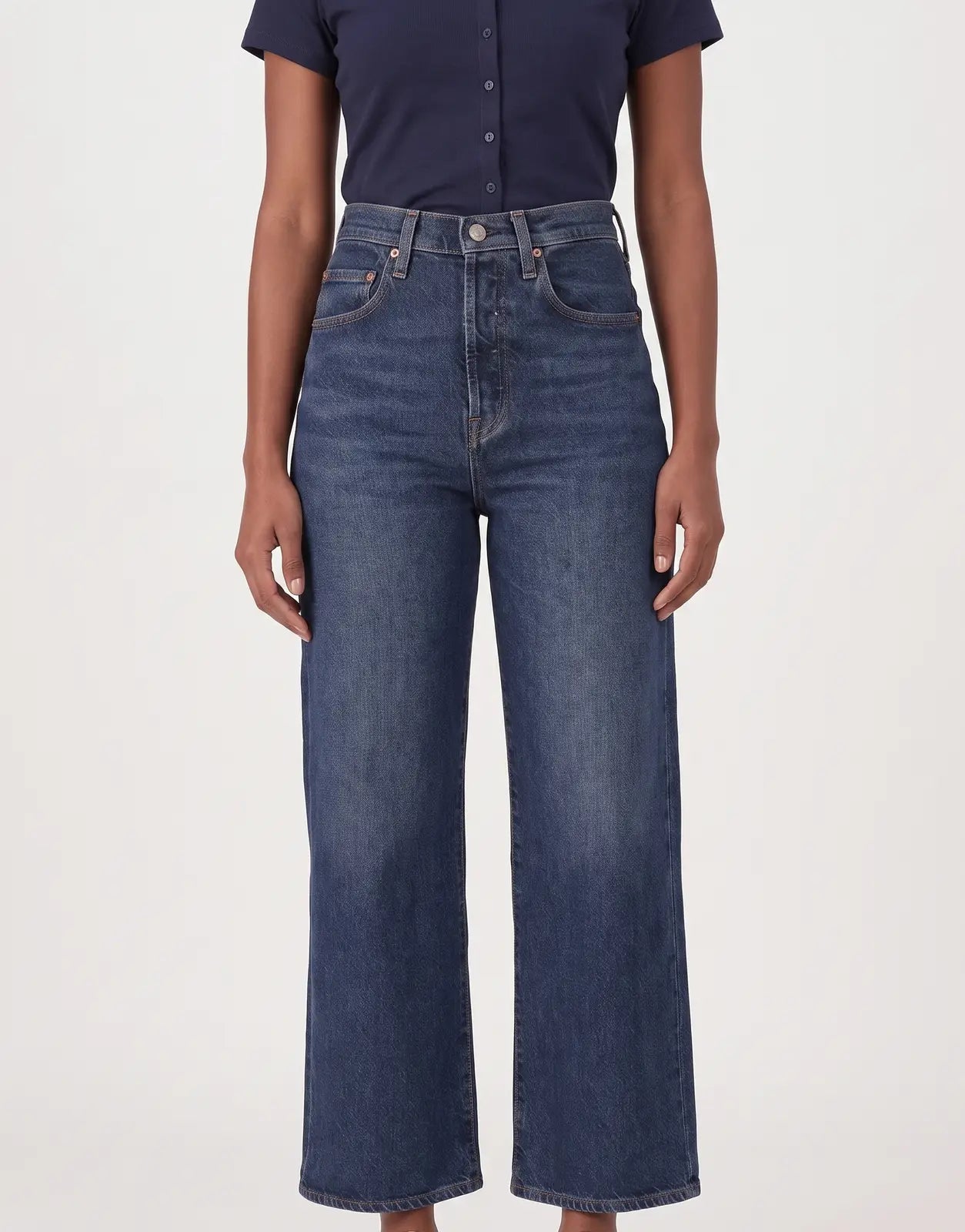 Levi's 501 Women Array Away Jeans in a dark wash, high-waisted, wide-leg style on a female model in a studio.