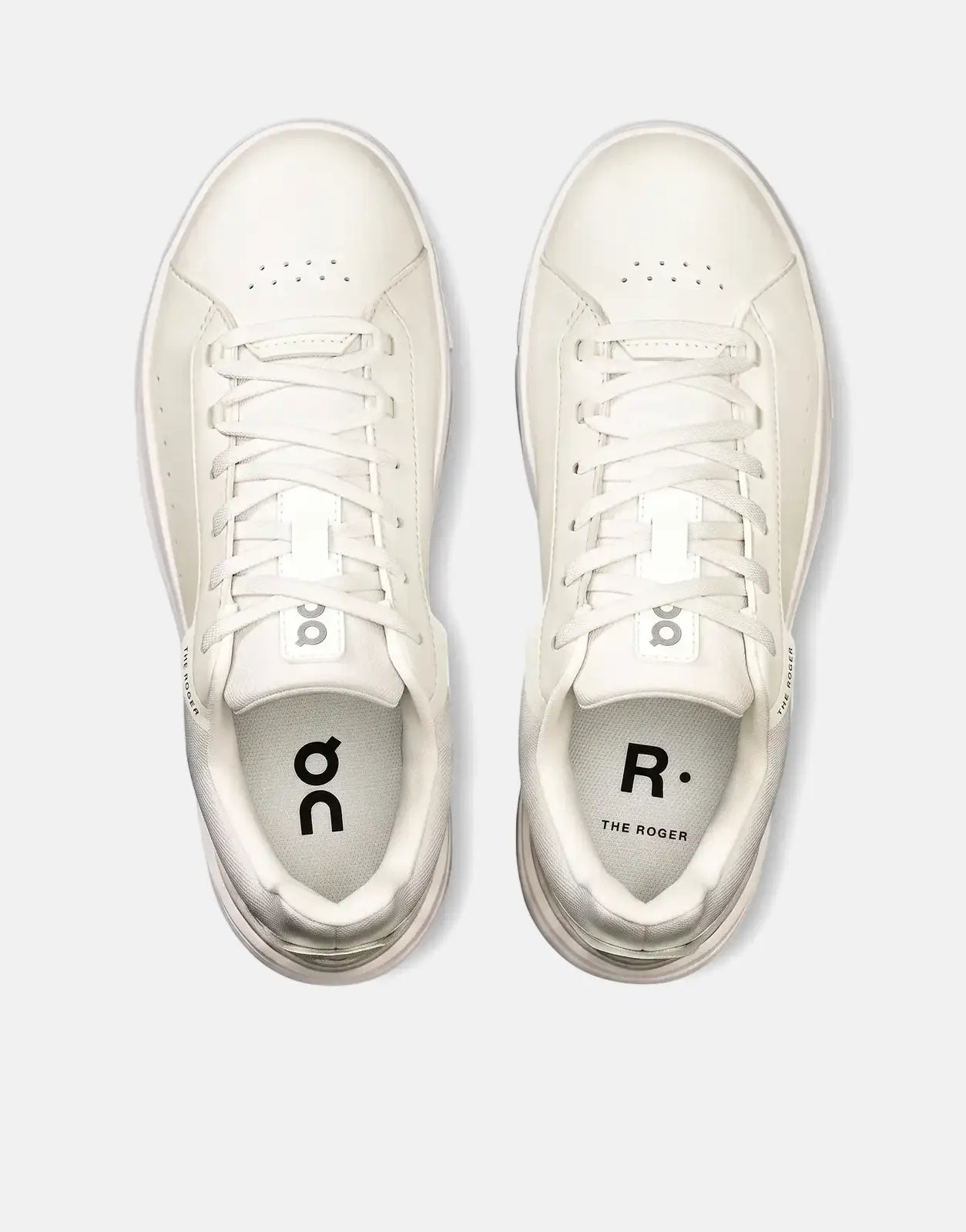 Overhead view of a pair of On Women's Roger Advantage white leather sneakers with matching laces and minimal branding.