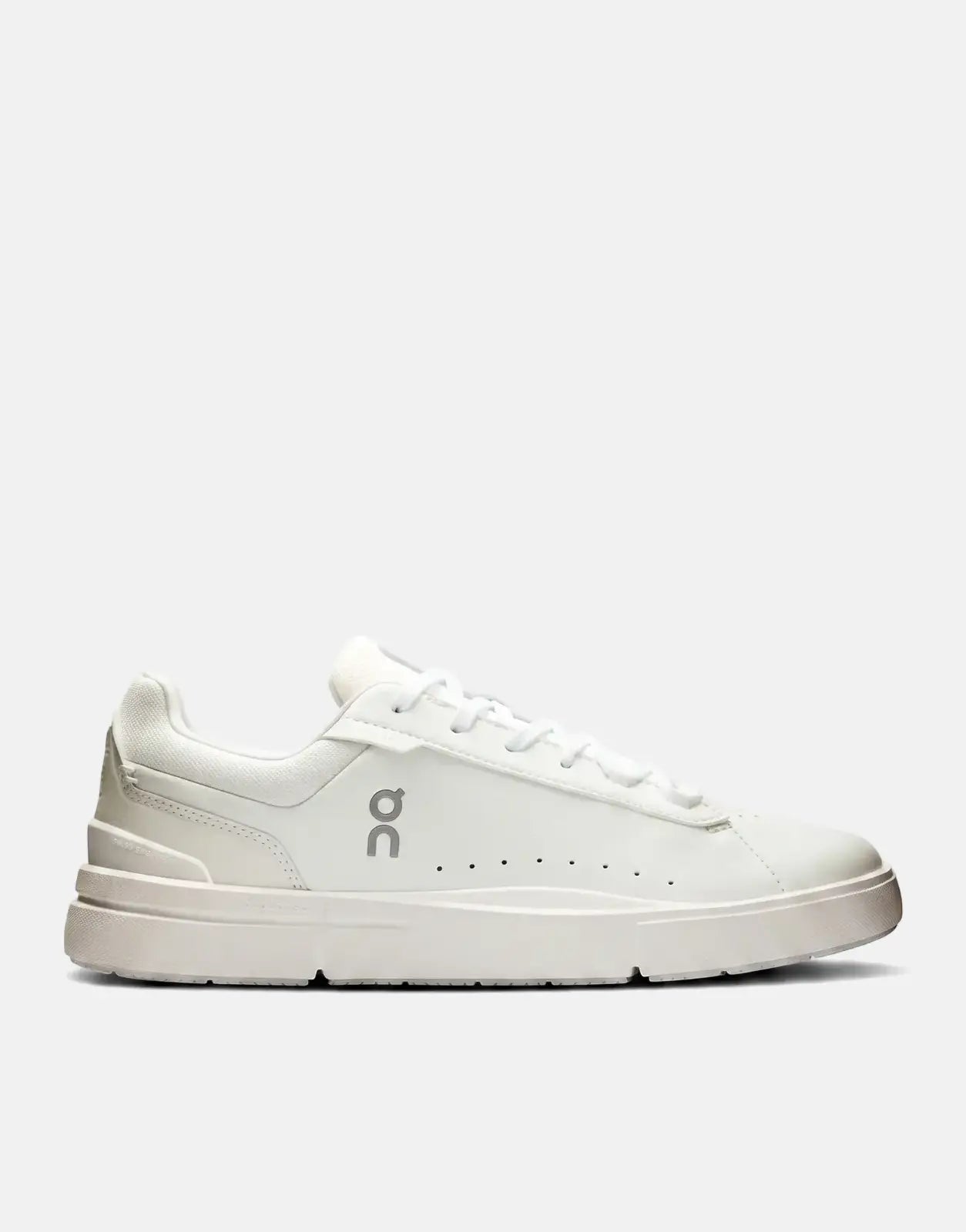 On Women's Roger Advantage sneaker in white, featuring a smooth leather upper and a low-profile design, shown from the side.