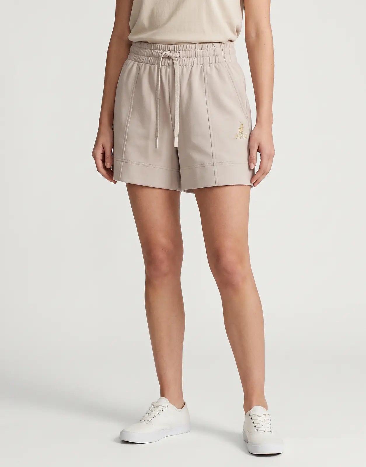 Polo Zoe Soft Track Mushroom Shorts in a soft, light beige fabric, with an elastic drawstring waistband and a gold logo on