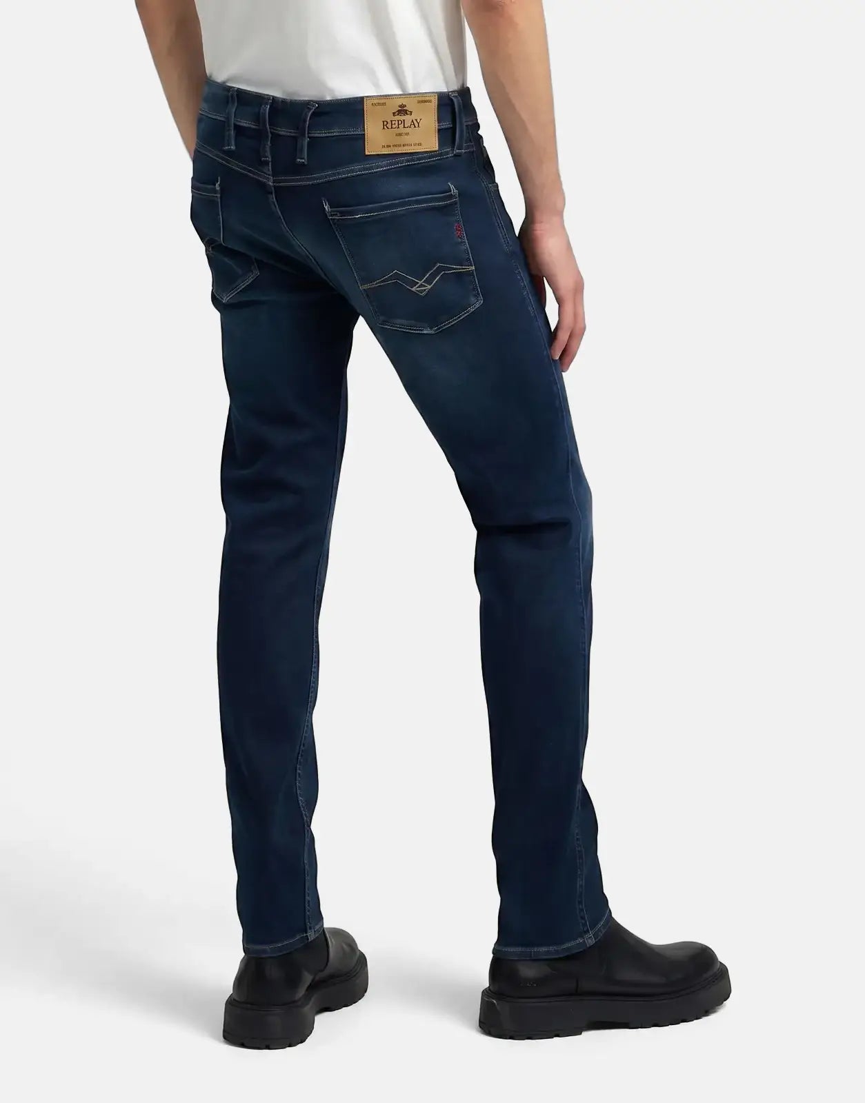 Dark blue slim fit men's Replay Anbass jeans with a prominent back label, shown from a rear view.