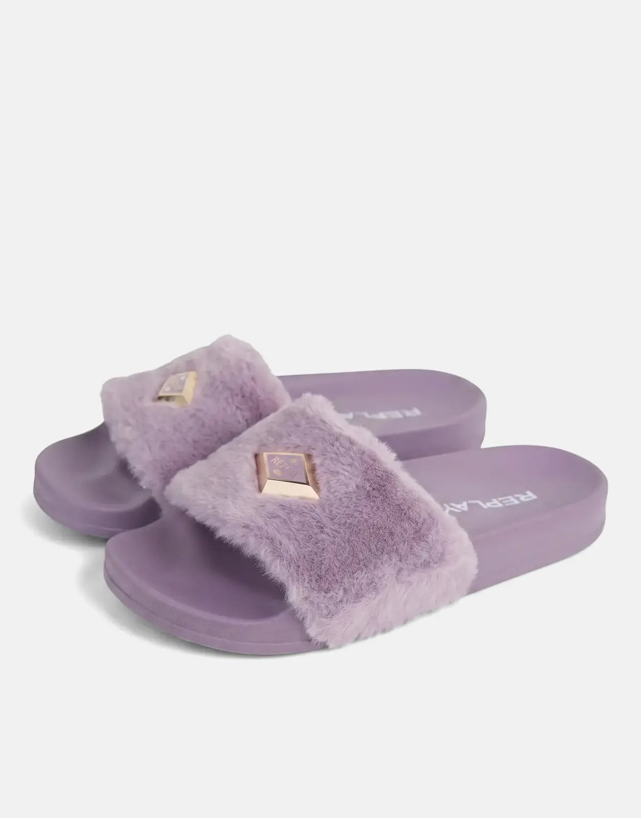Pair of Replay Up W Along Lilac Slides featuring fluffy purple straps and gold pyramid studs, seen from a slight angle.