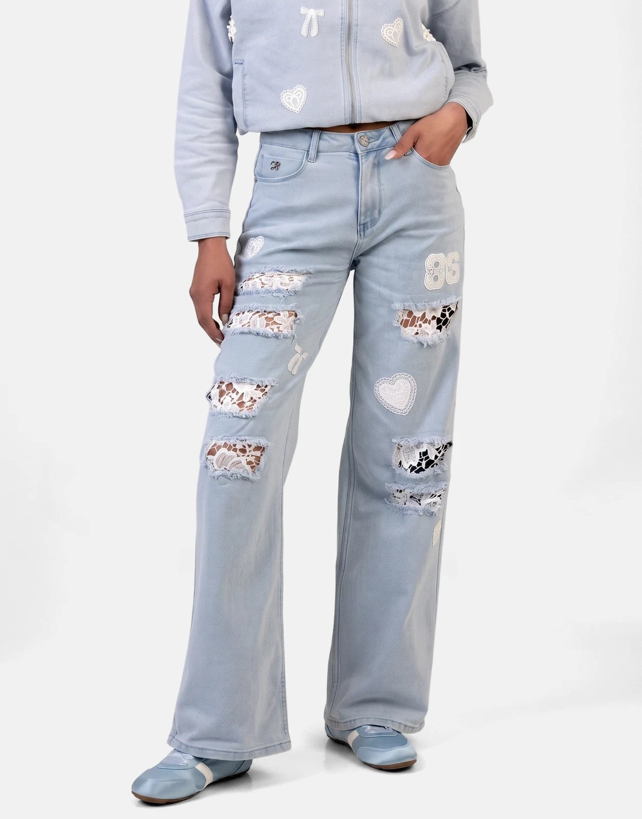 Sissy Boy Kiera wide leg light vintage jeans with white lace patches and matching denim jacket and shoes.