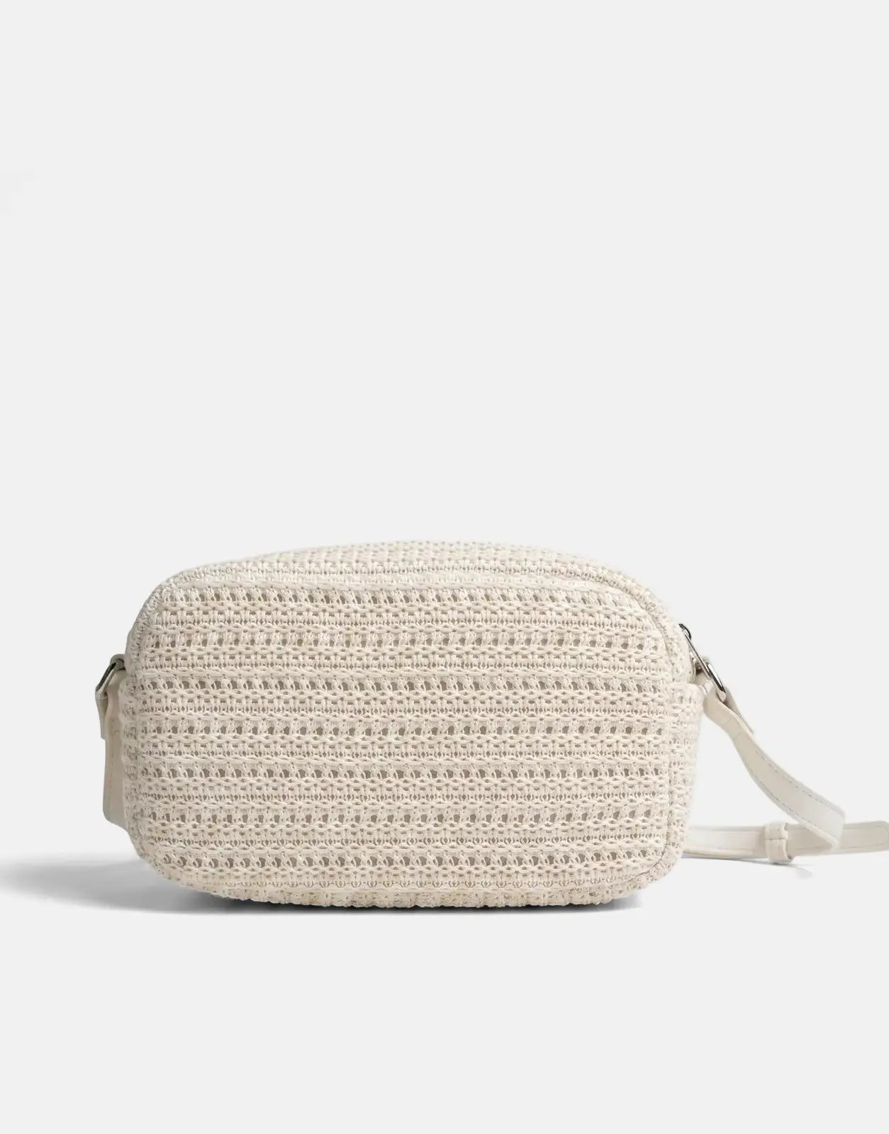 Sissy Boy Wren off-white knitted crossbody bag with a textured finish, shown resting on a surface.