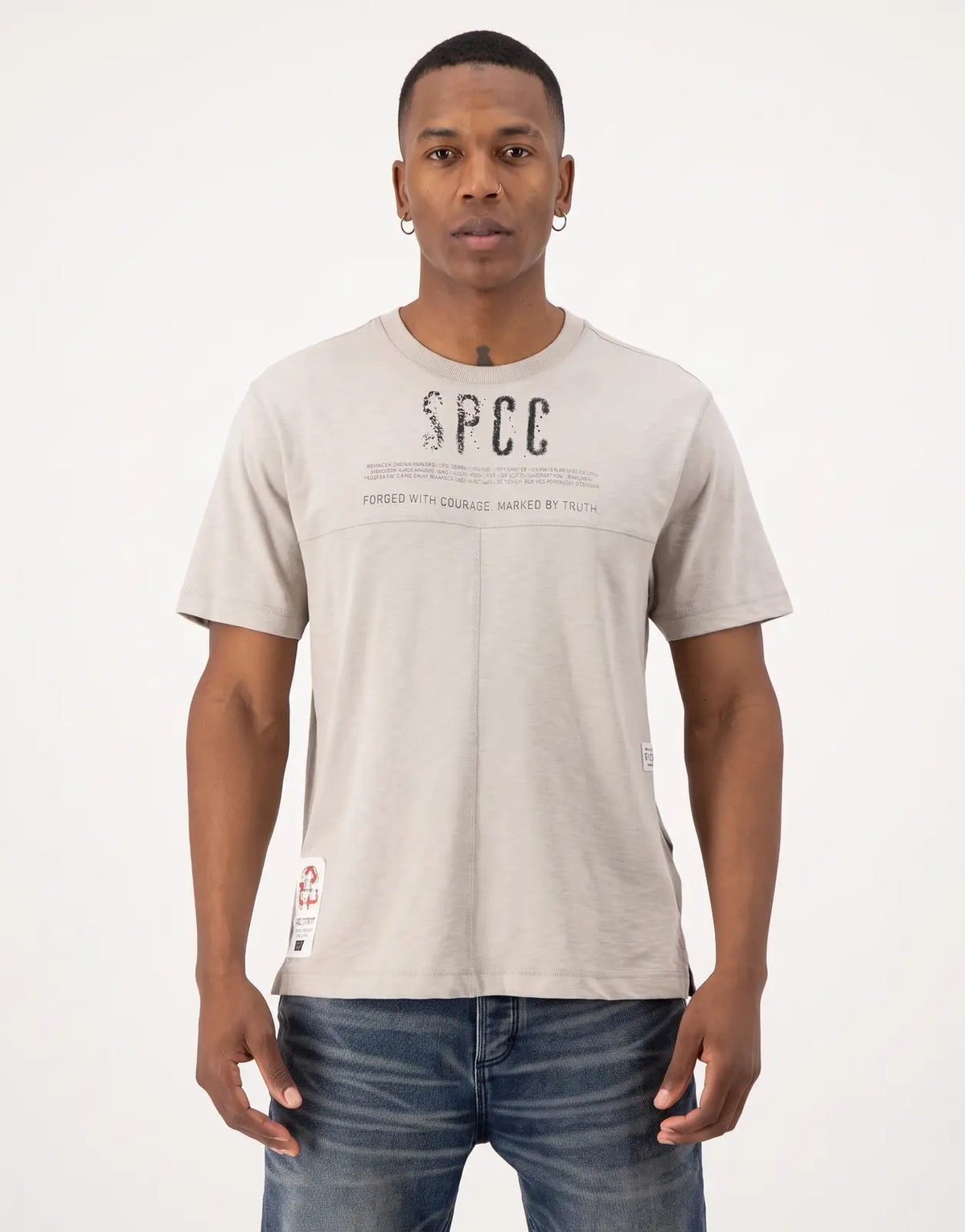 SPCC Troy Tee in light grey for men, featuring a distressed graphic print on the chest, worn by a model.