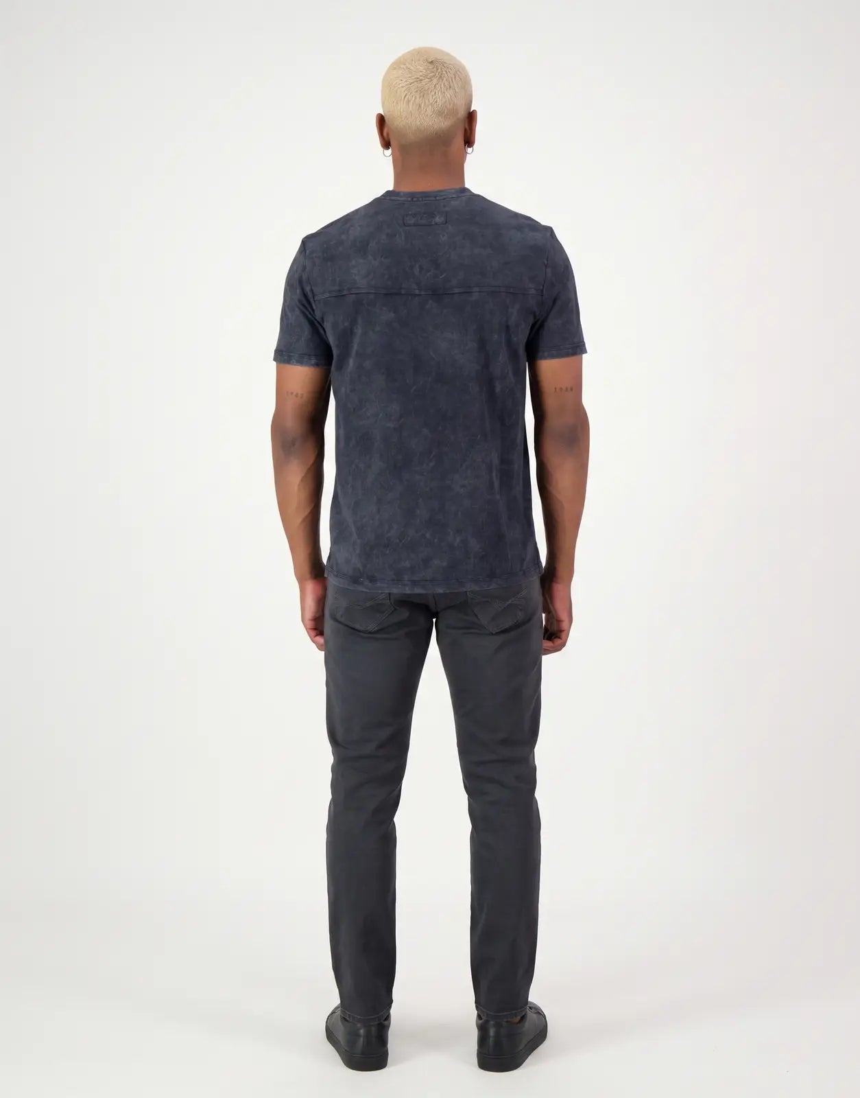 SPCC Victor T-Shirt in black, featuring a stone wash finish and short sleeves, displayed from the back on a model.