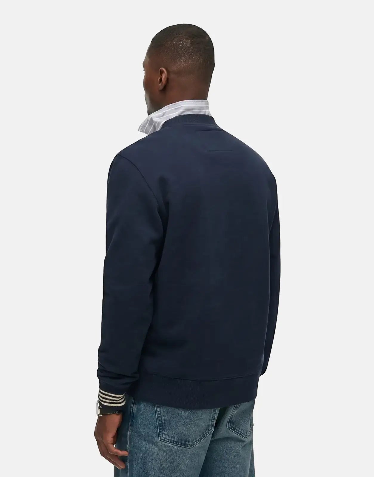 Superdry Athletic Club navy blue sweatshirt on a male model, viewed from the back, showing the crew neck and ribbed cuffs.