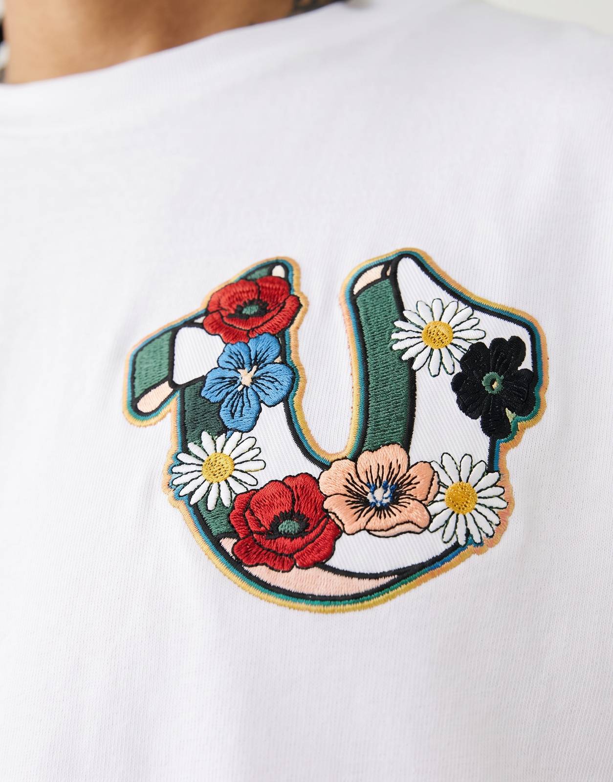 True Religion Garden Logo T-Shirt White featuring a colorful embroidered floral patch on the chest.