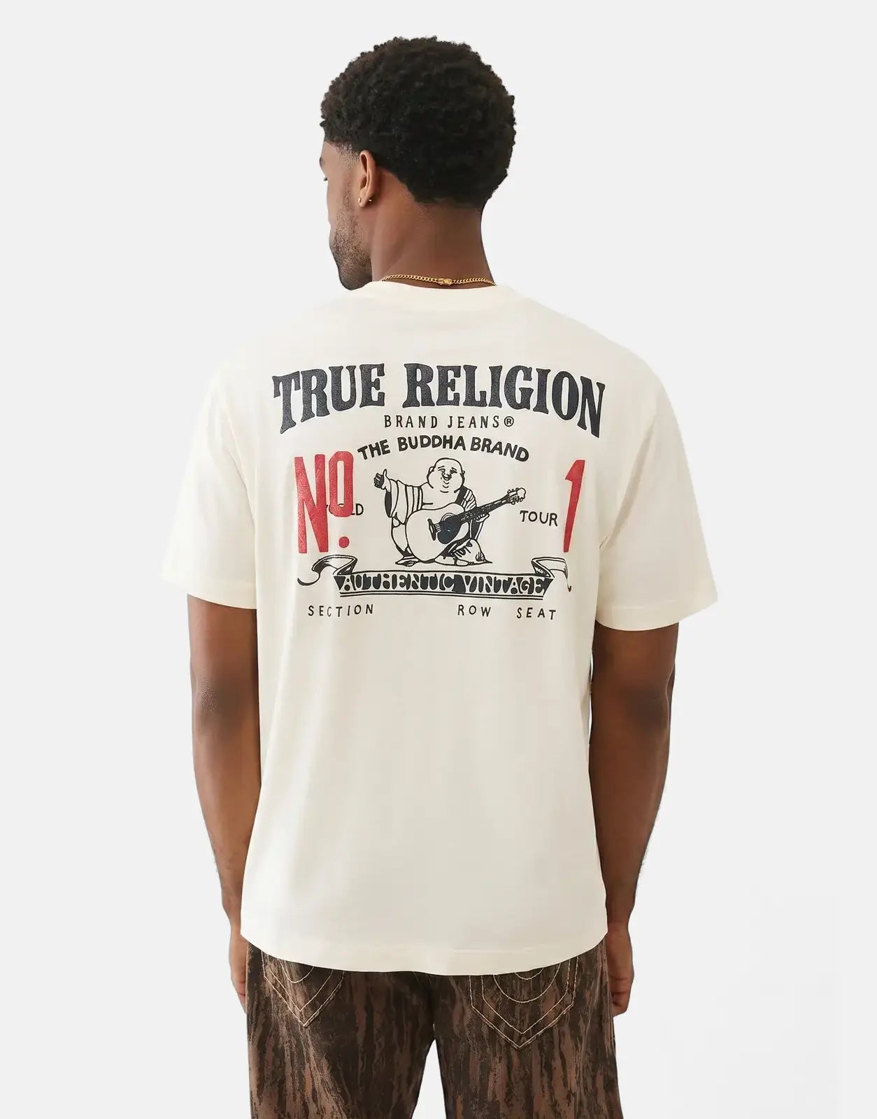 True Religion Number One SRS T-shirt for men in cream, featuring a large graphic print on the back, worn by a model.