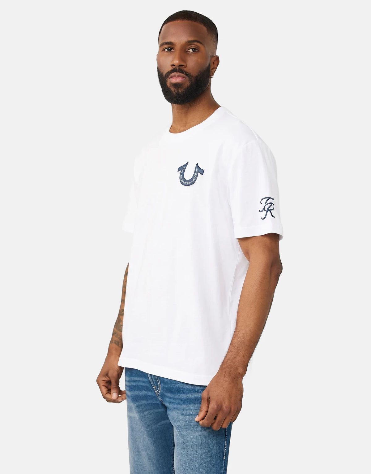 Men's white True Religion Super True short-sleeve t-shirt with blue horseshoe logo on chest and TR logo on sleeve, shown on