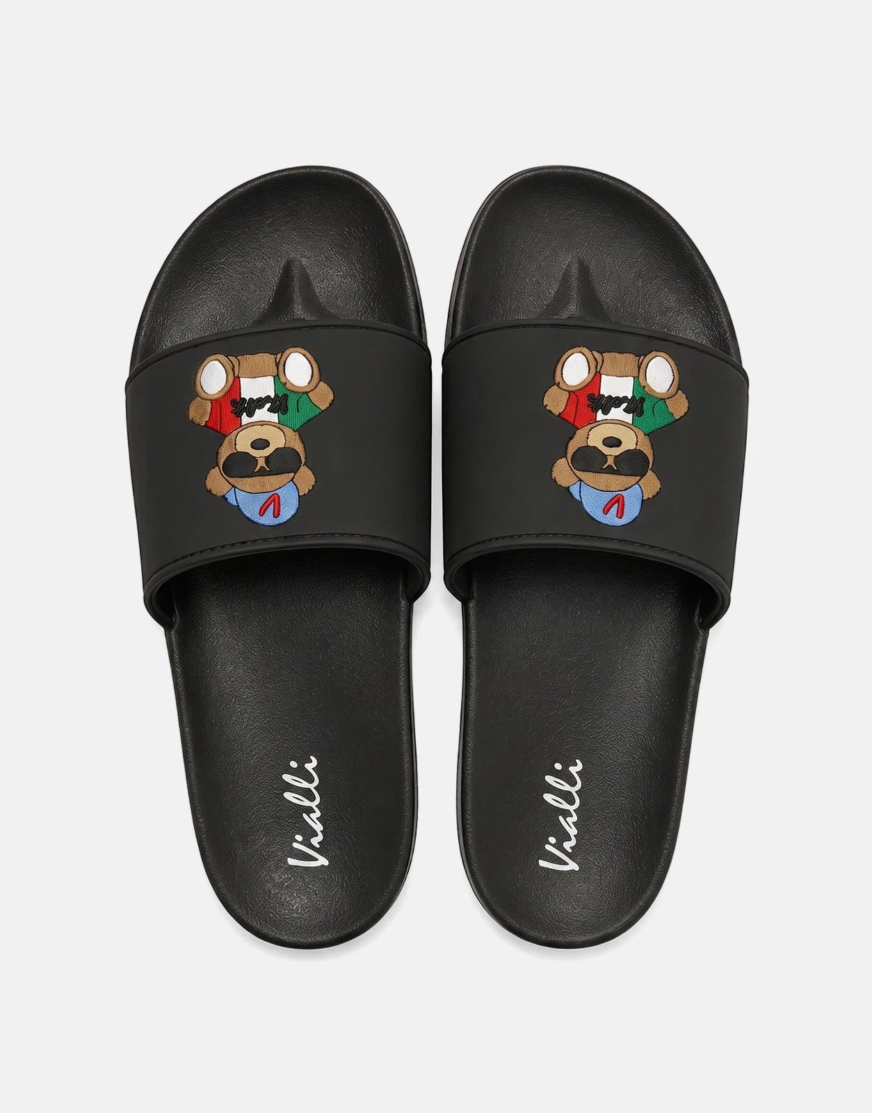 Pair of Vialli Yogi Black Sandals featuring an embroidered bear design on the strap, presented in a flat-lay top-down view.