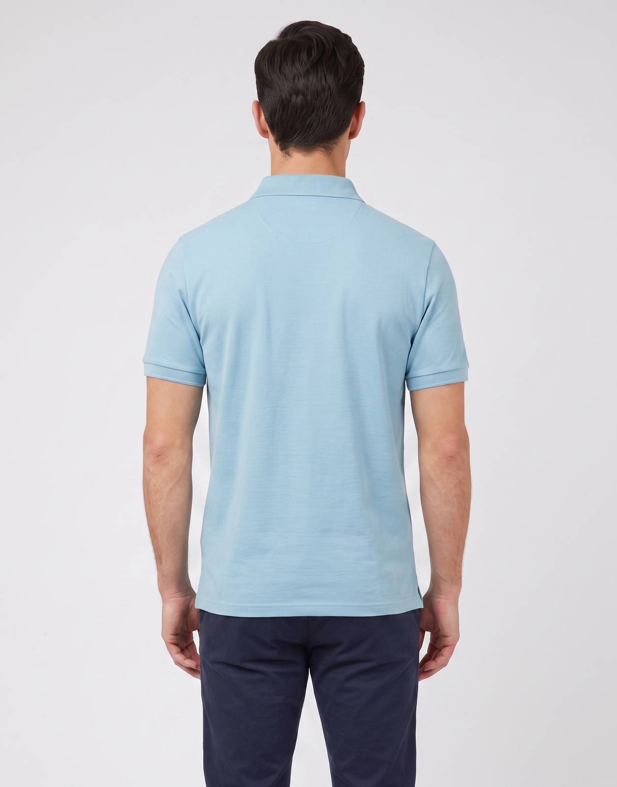 Back view of a Ben Sherman Ben Polo shirt in retro blue on a male model, showcasing its classic design and smooth fabric.