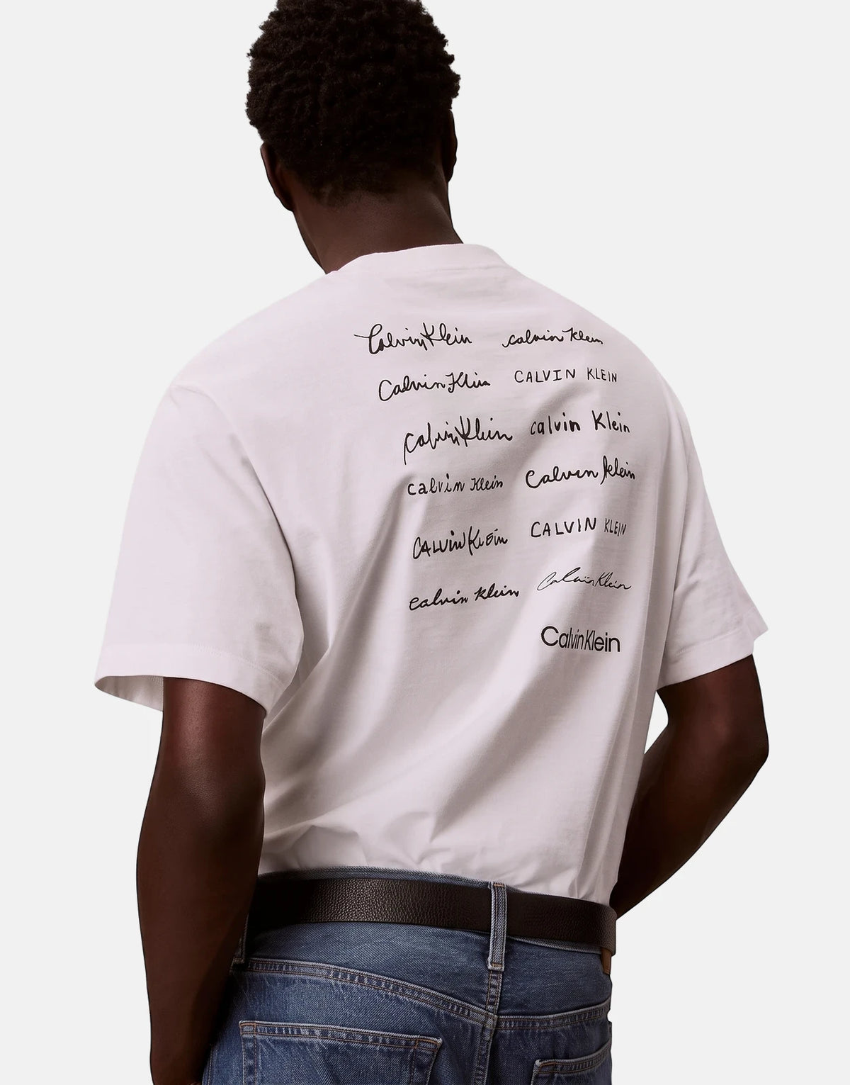 Calvin Klein 16s April Graphic Seasonal Fashion white t-shirt worn by a male model, showcasing the back with multiple