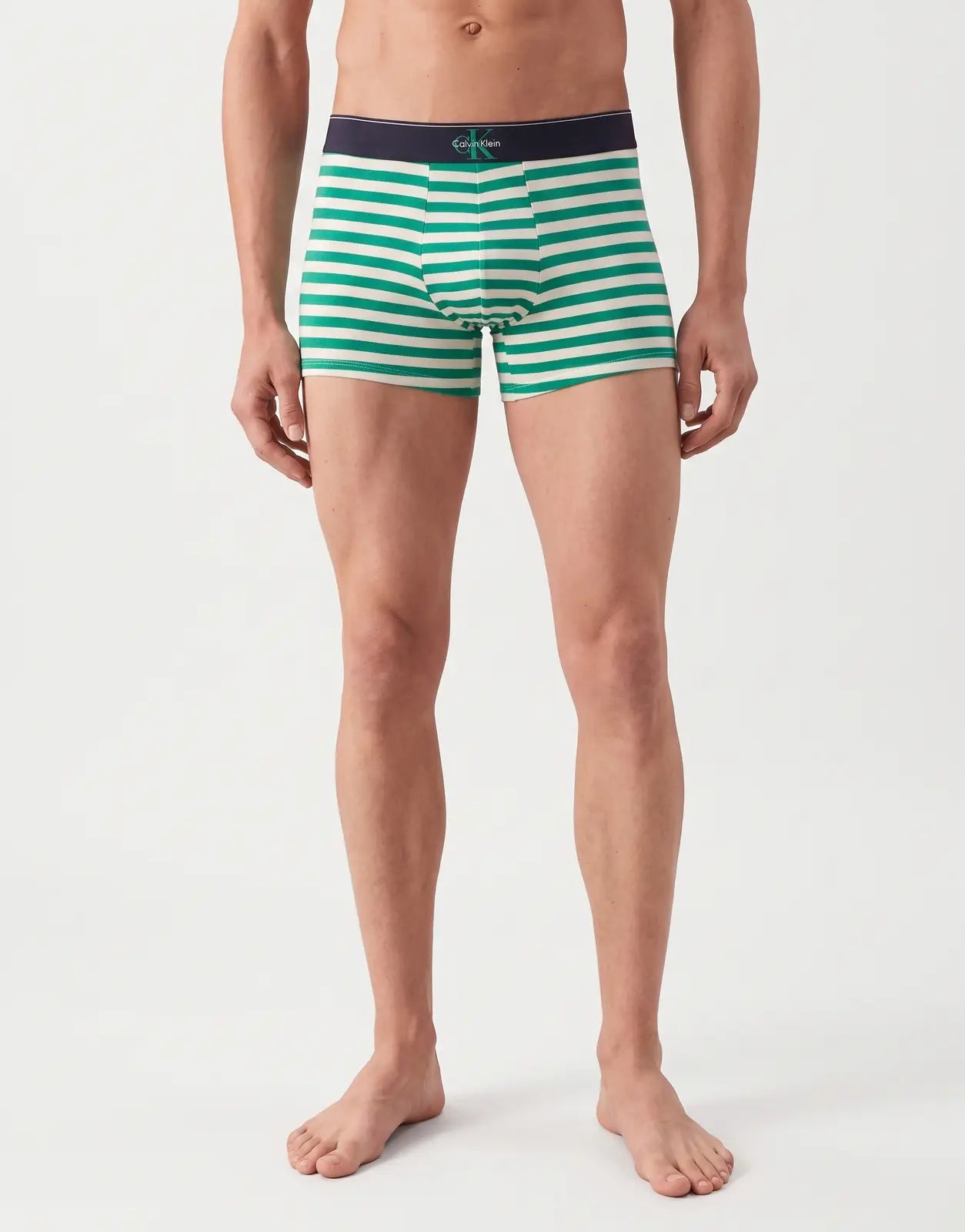 Calvin Klein 3 Pack Blue Multi Trunks for men, featuring green and white horizontal stripes, worn by a model in a front view.