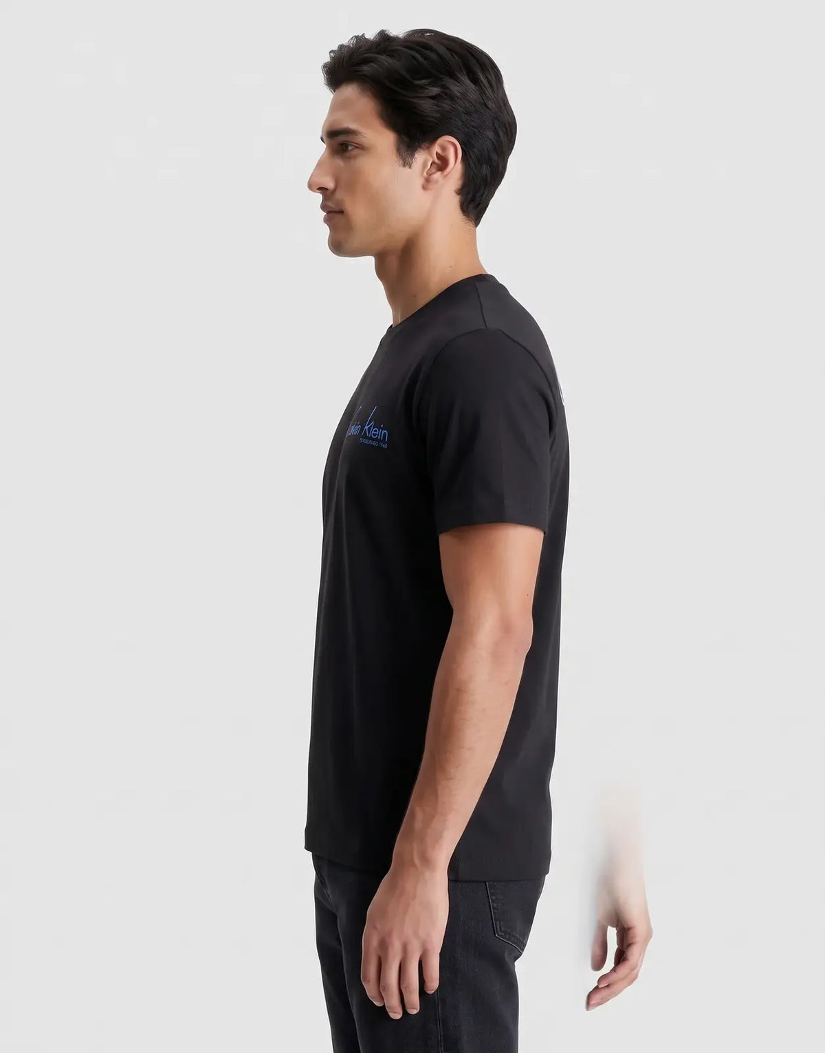 Calvin Klein 30s Wholesale Jeans graphic t-shirt in black, men's short-sleeve cotton tee with blue logo on chest